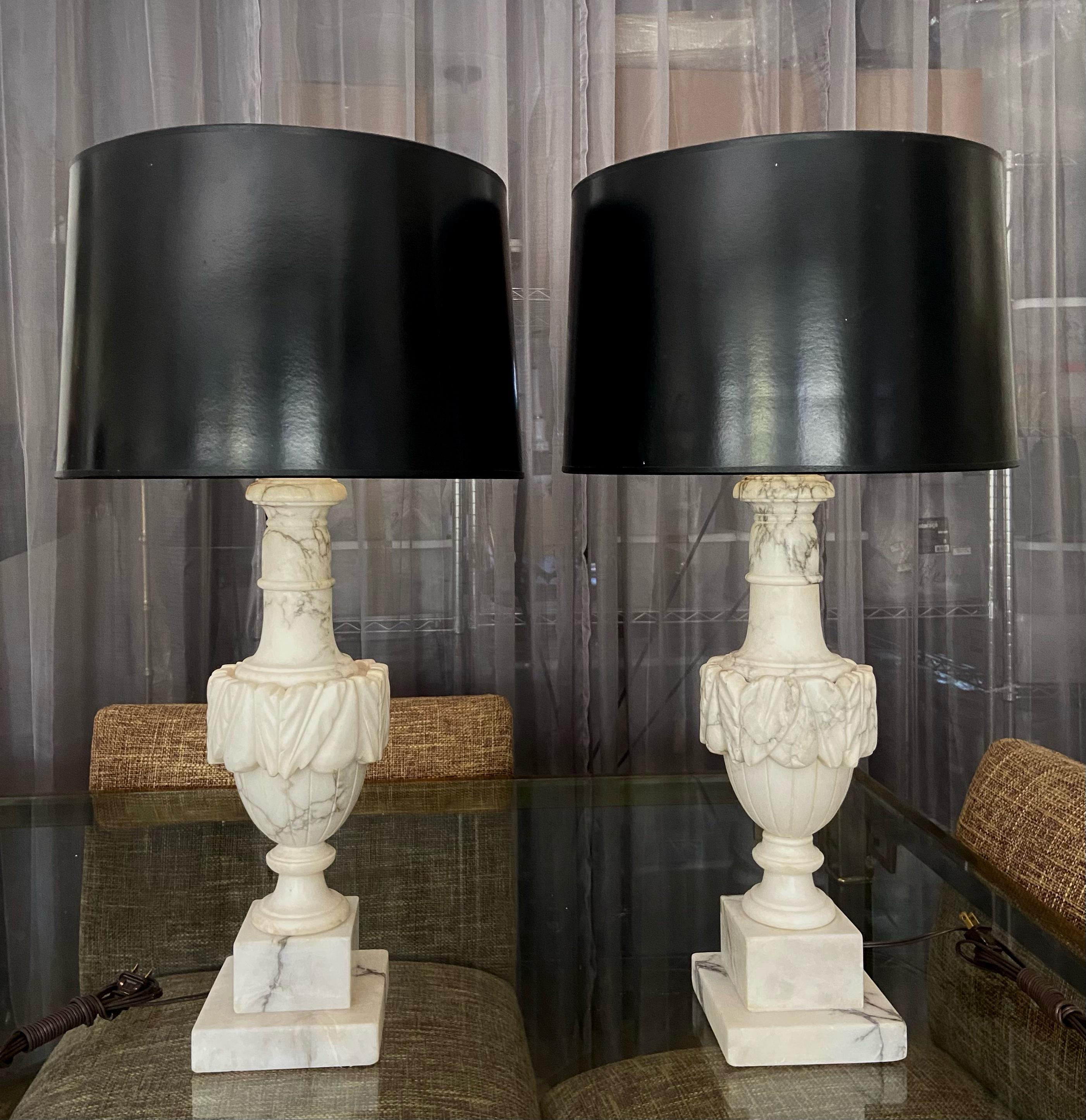 Pair of finely crafted hand carved neo-classic style urn form alabaster lamps. Newly wired with new brass 3 way sockets and cords. Shades are not included.
Height to top of alabaster is 18.5