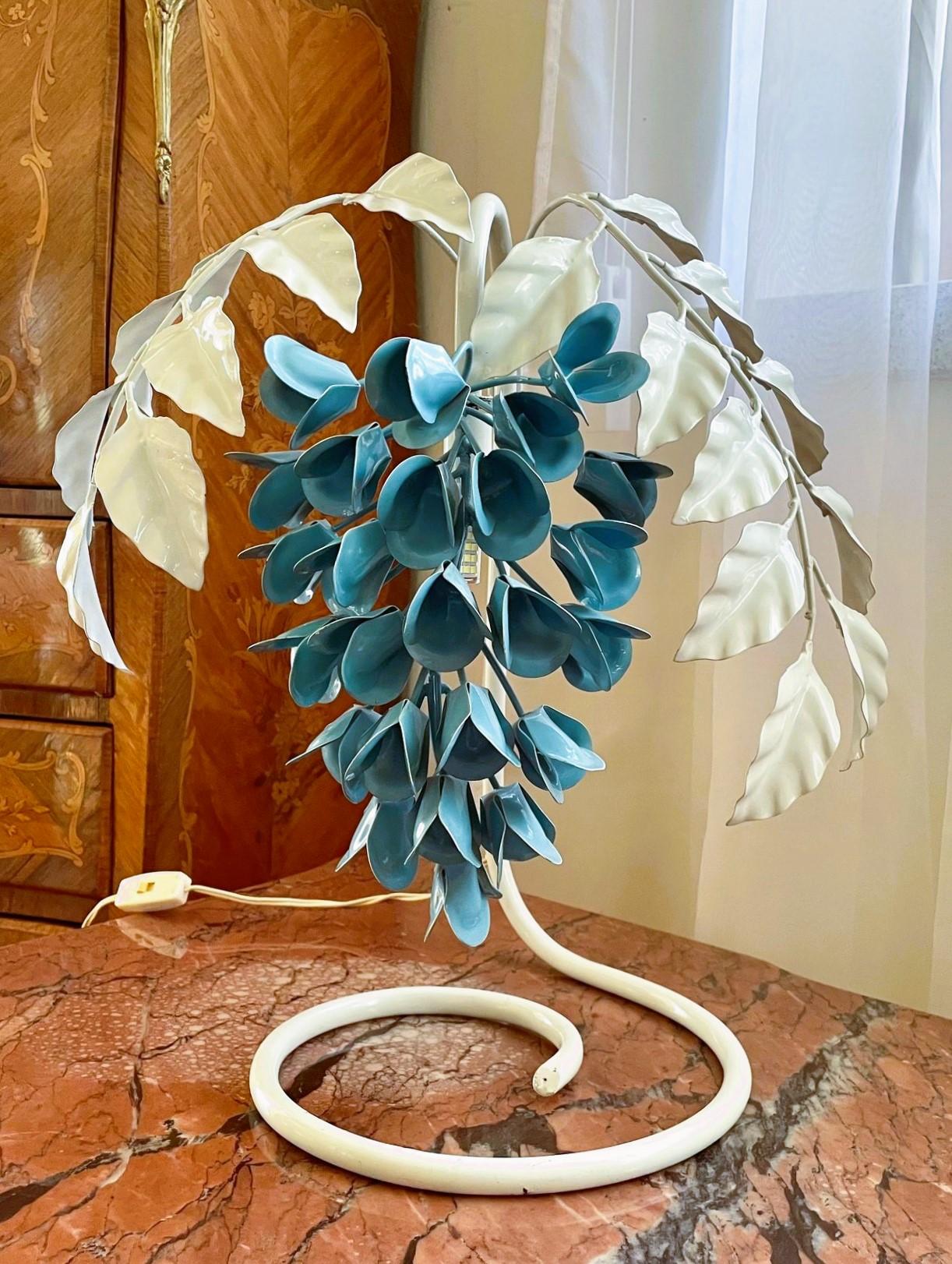 A rare pair of enameled metal Wisteria table lamps designed by Sergio Terzani, Italy, 1970s, with cream enameled curved tubular base supporting a lampshade composed by two branches of laurel leaves and flowers in shape of wisterias - one lampe with