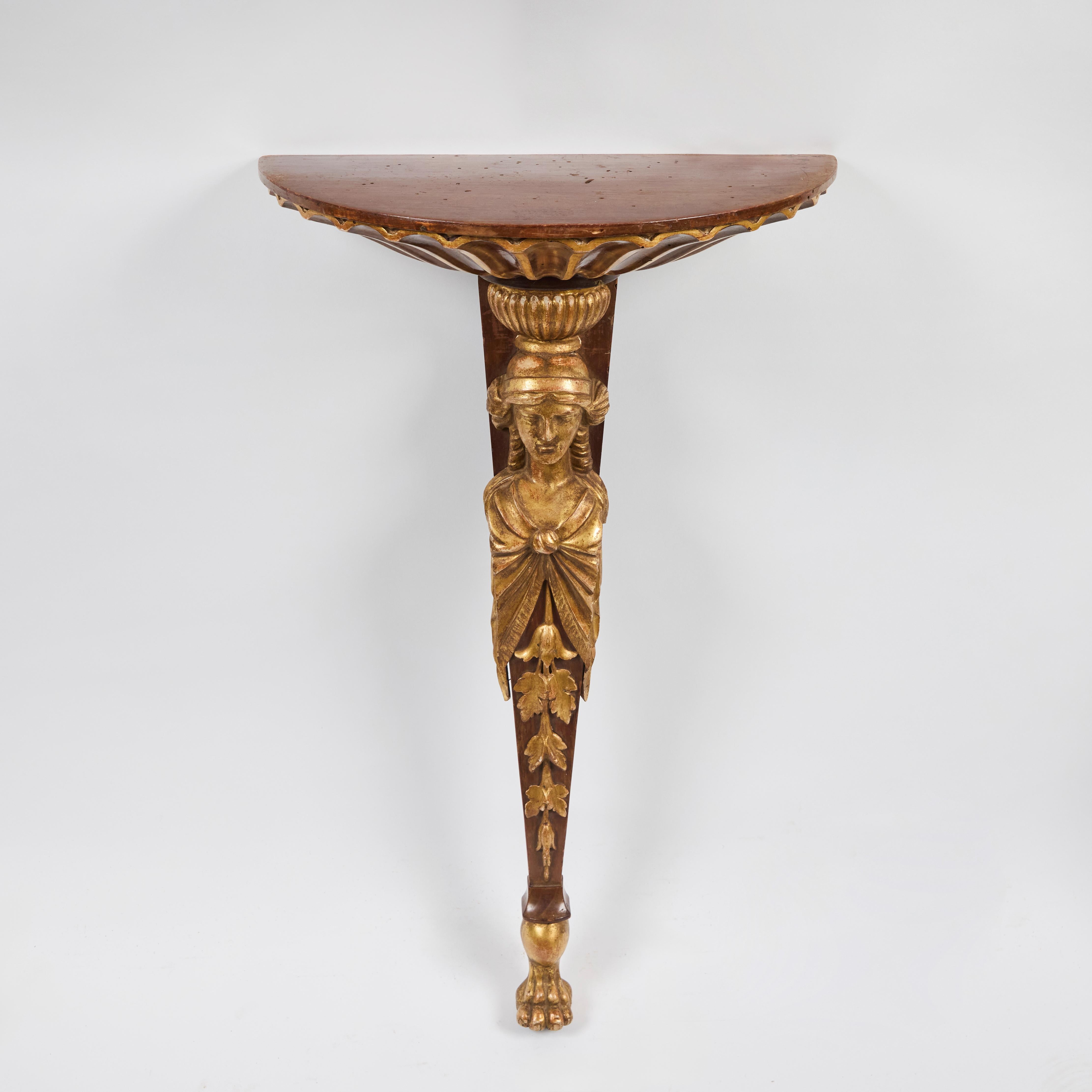 Pair of hand-carved and parcel gilt, figural, walnut wall brackets from Florence, Italy.