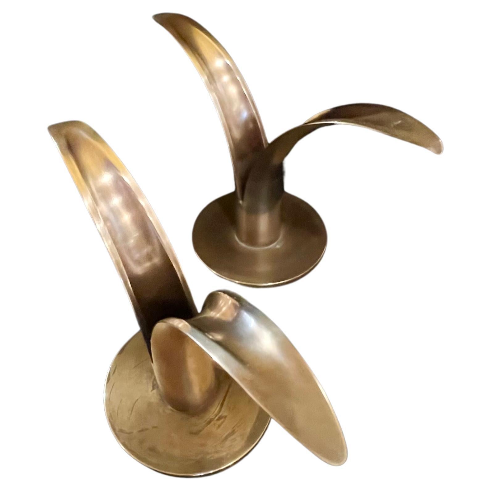 Beautiful Pair of solid brass candle holders by Ivar Åhlenius Björk and Lily Liljan for Ystad Metall in patinated Brass.  Made in Sweden