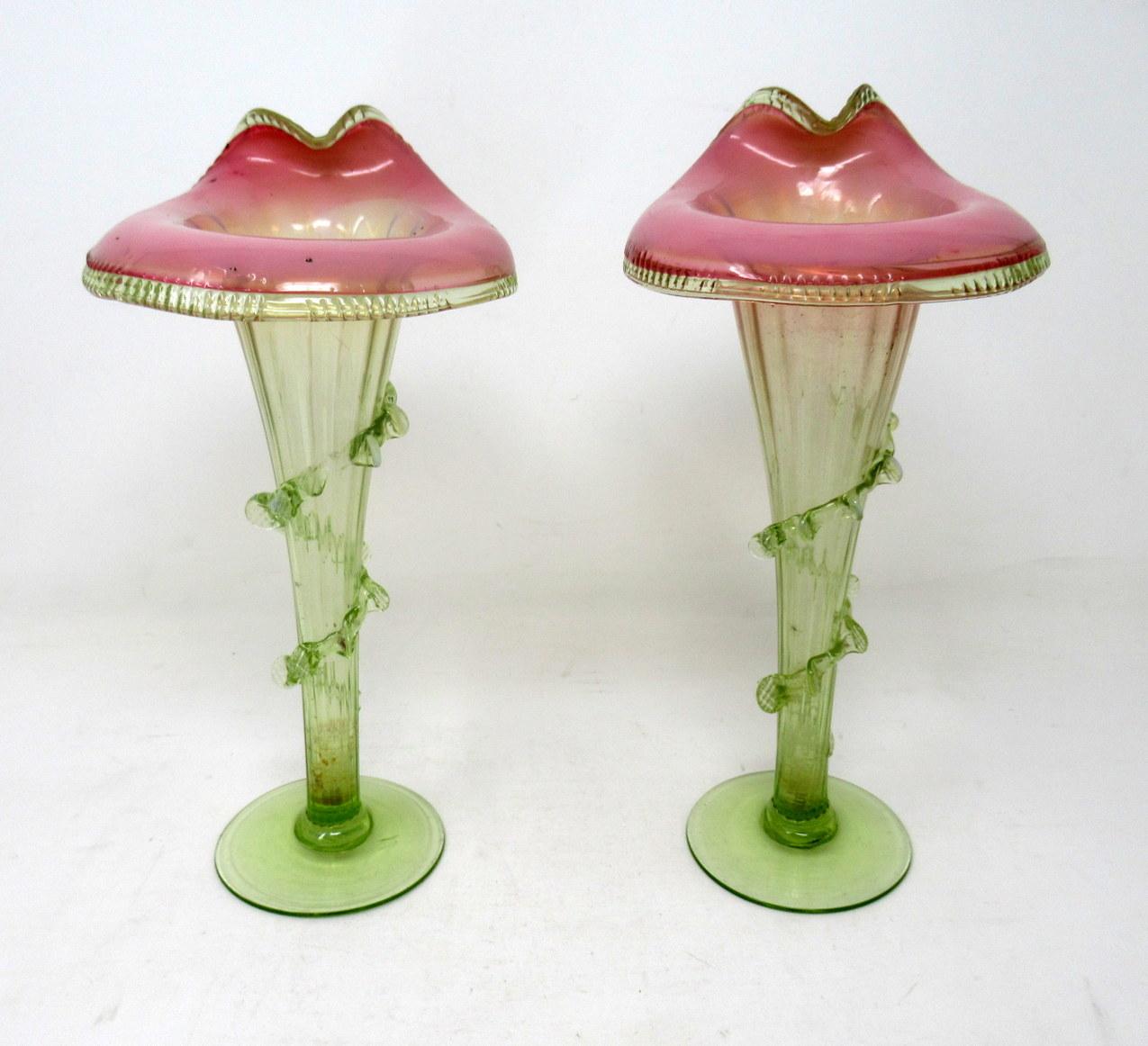 Wonderful identical pair of early victorian english hand blown jack in the pulpit iridescent flower vases firmly attributed to Thomas Webb. Stourbridge, England from 1804 till 1869. 

The tapering ribbed central column with applied trailing