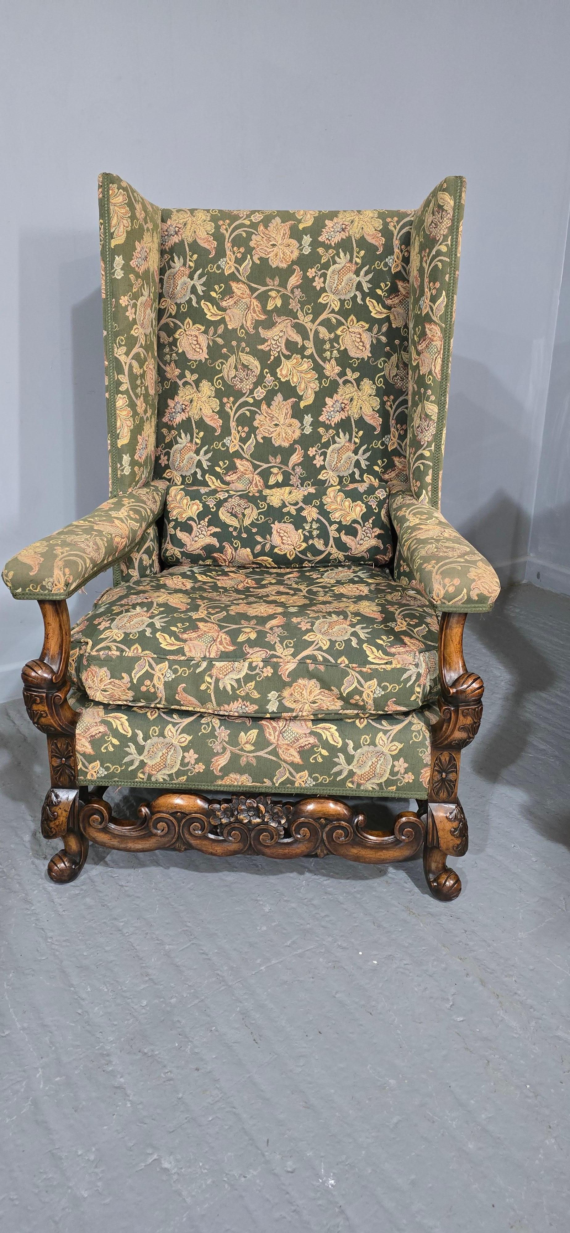 A very nice pair of Jacobean style walnut wing armchairs, feather filled cushions, slight fading to upholstery, very good overall condition.

46