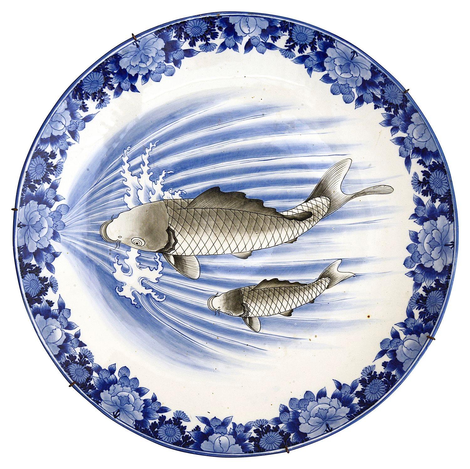 A wonderful pair of fine quality Japanese Blue + White Arita porcelain chargers, depicting Carp swimming against fast flower water, with a floral boarder to each. Meiji period 1868-1912.


Batch 82 G344/24. DNKZZ
