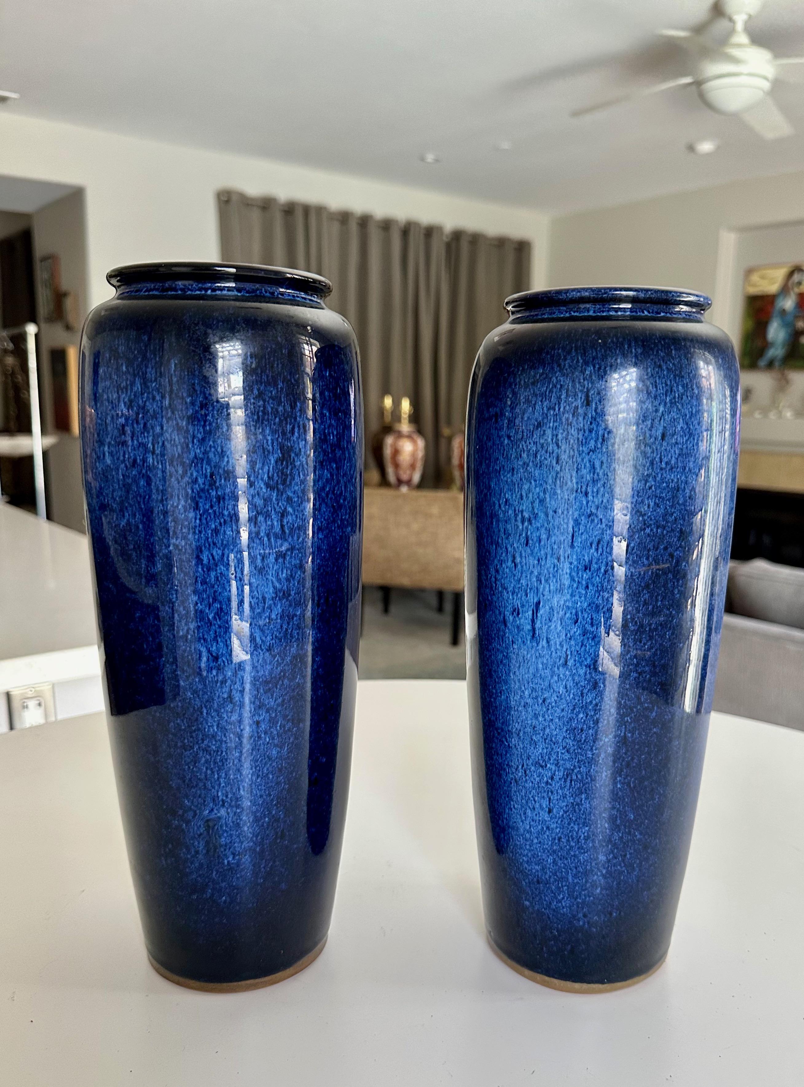 Pair Japanese cobalt blue flambe mottled pattern pottery vases. One vase is signed. 