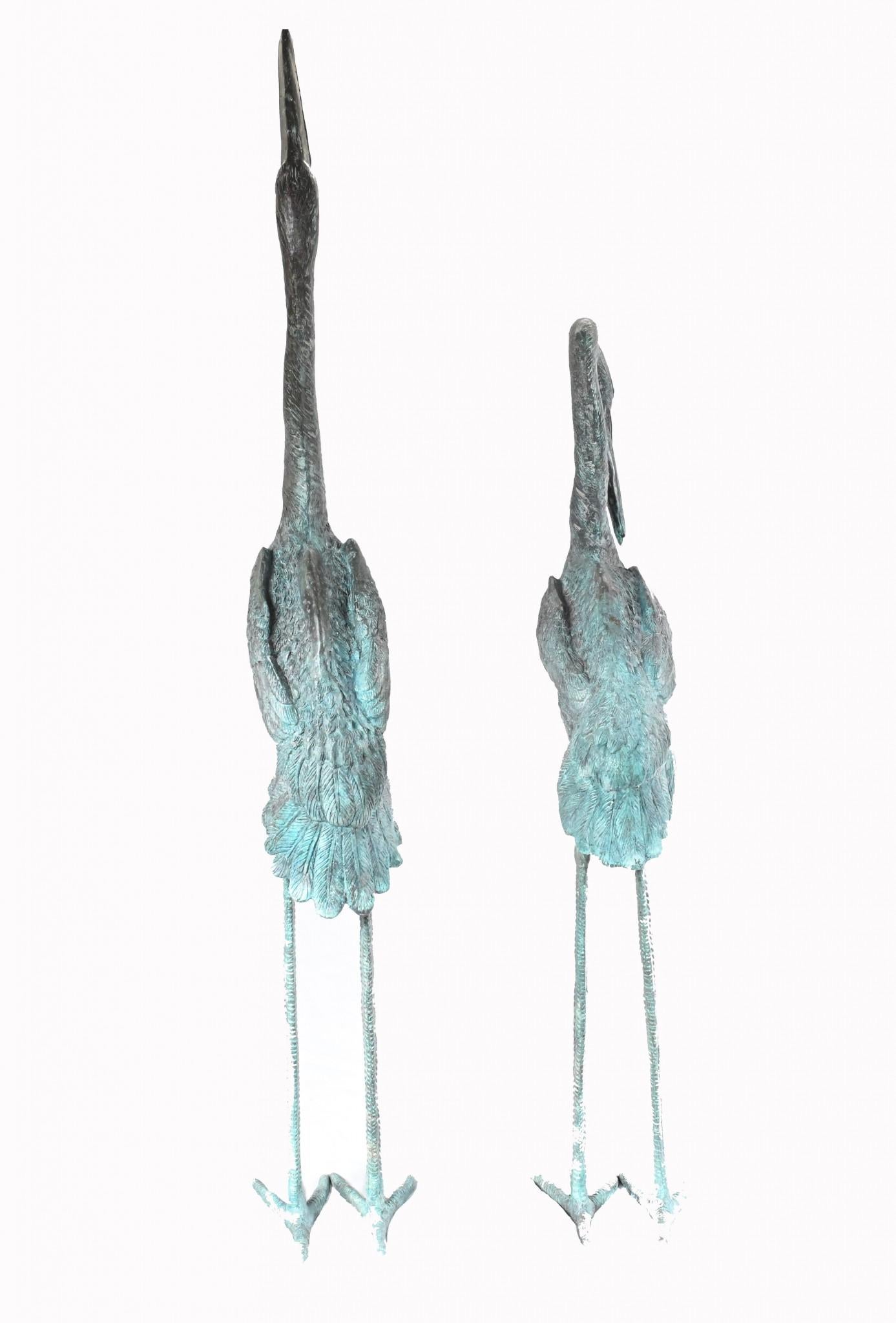 Stunning pair of bronze Japanese cranes
Tallest stands at 53 inches - 137 CM - so impressive size
Of course being bronze these can live outside with no fear of rusting so great for a garden, would look fab in a pond or lake
Patina to the bronze is