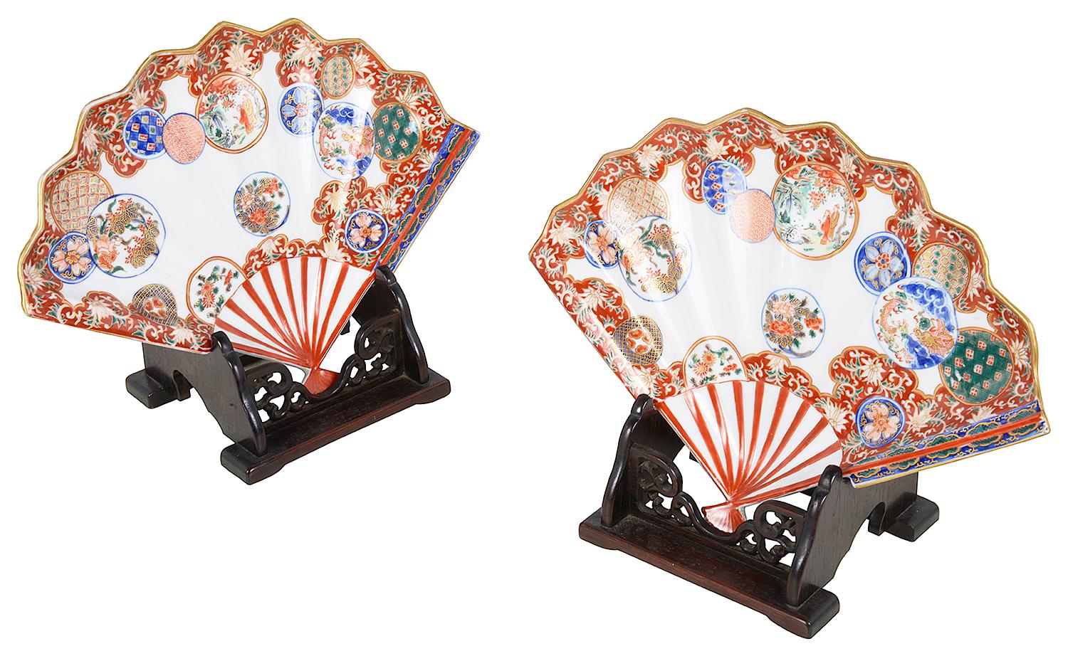 A wonderful fine quality pair of late 19th- early twentieth century, Meiji period Japanese Imari Fan shaped dished, each with classical motif, scrolling foliate hand painted decoration with inset panels depicting various mythical dragons, people in
