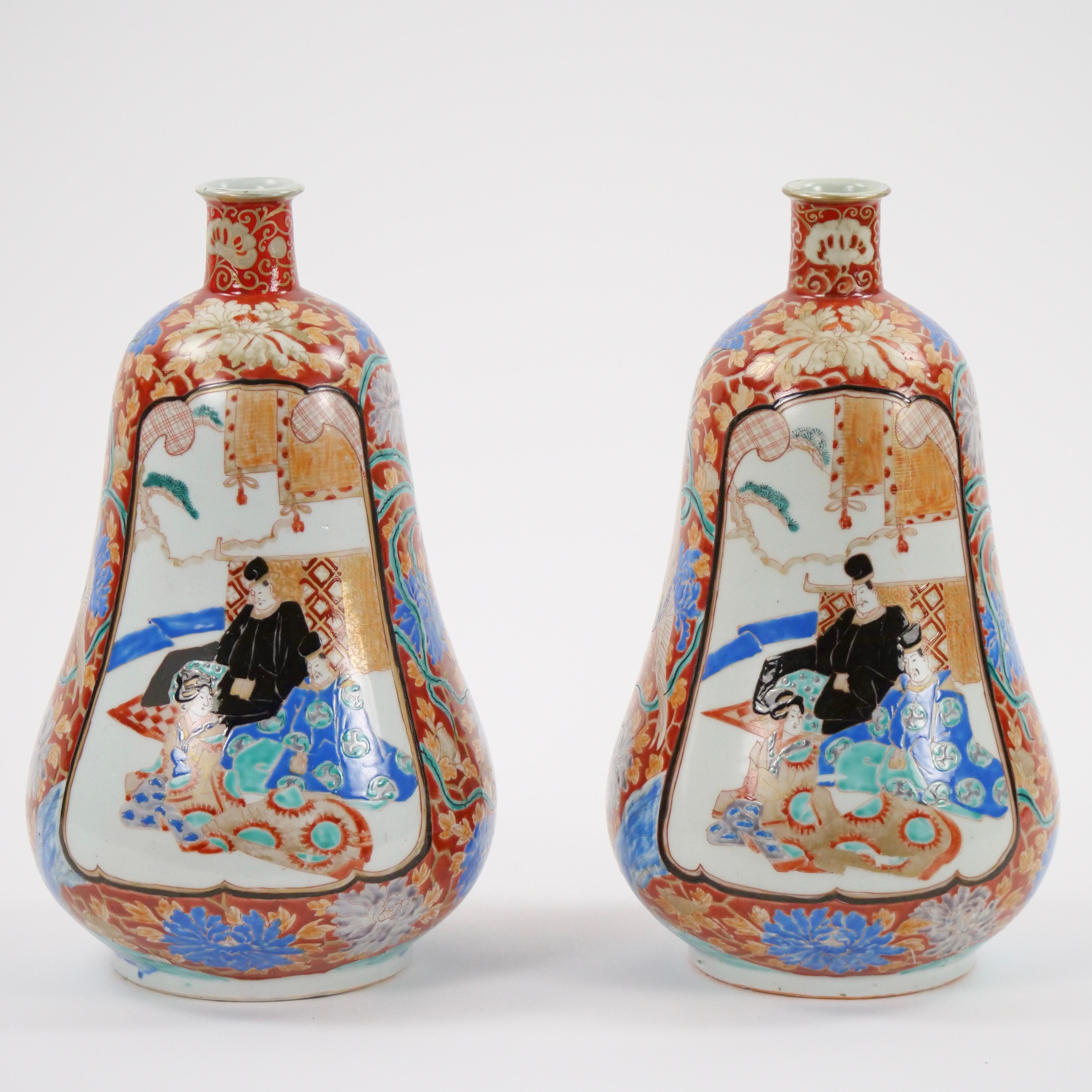 Experience the captivating charm of Japan with this pair of Imari gourd-shaped porcelain vases. These vases beautifully showcase the renowned Imari style, which has captured hearts around the world for its intricate patterns and vibrant color