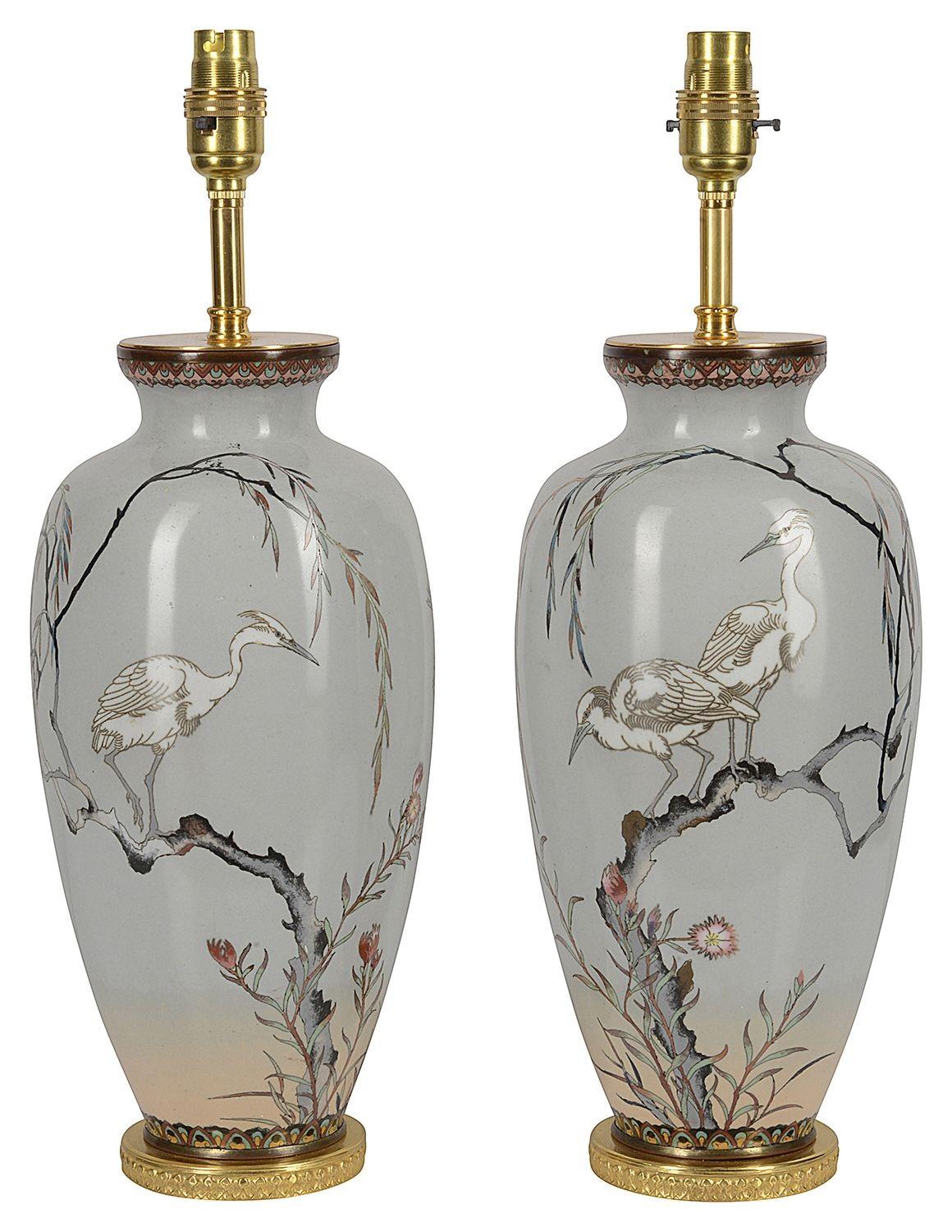 A fine quality pair of Japanese Meiji period (1868-1912) Cloisonné enamel vases, each having a Grey colour ground with wonderful Herons perched on trees with flowers and foliage around them, boarders to the top and bottom of classical motif