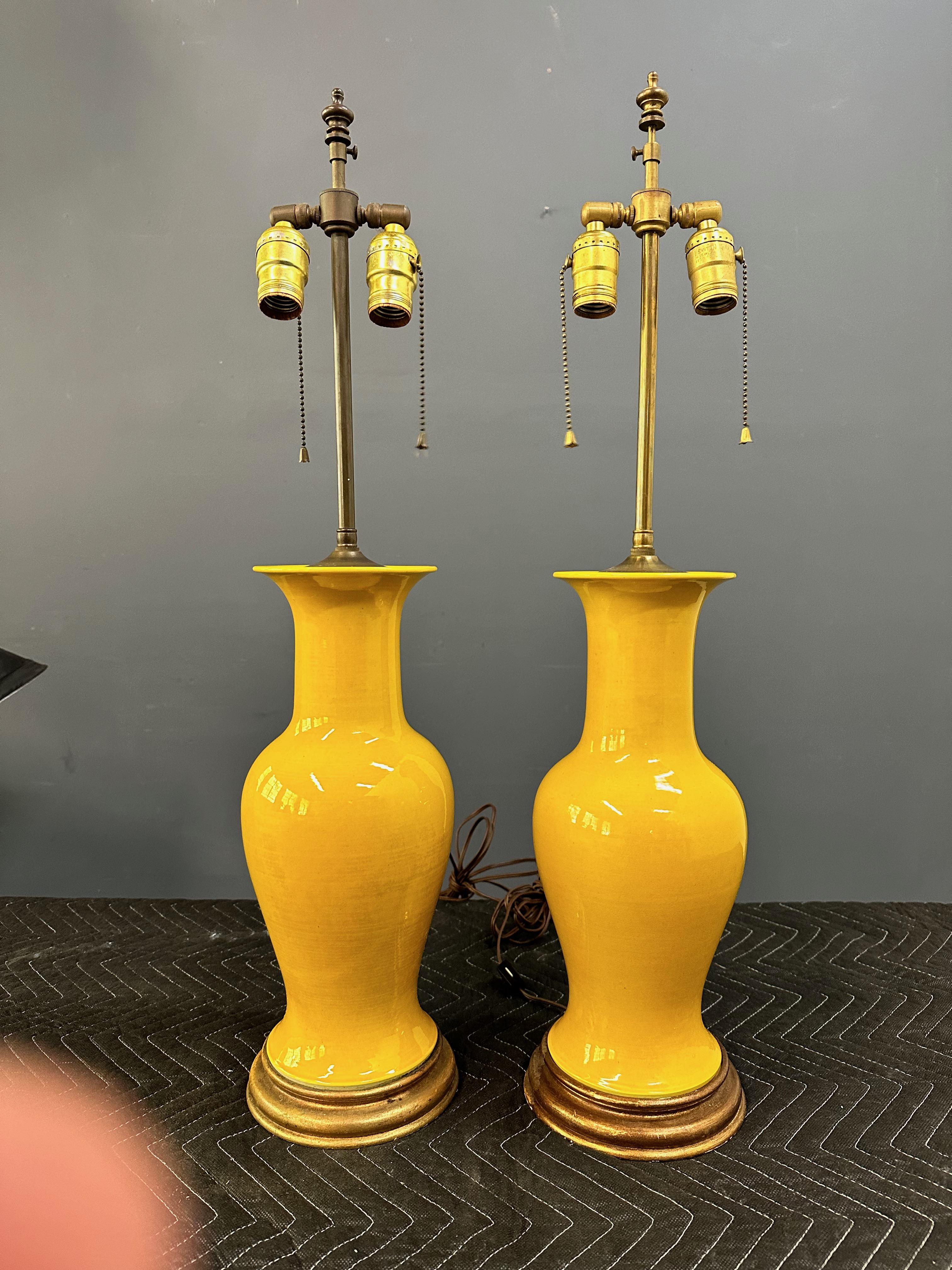 Vintage pair Japanese porcelain yellow monochrome lamps in baluster form with rich yellow crackle glaze, circa 1970's. Nice quality, heavy, double articulated sockets. 30