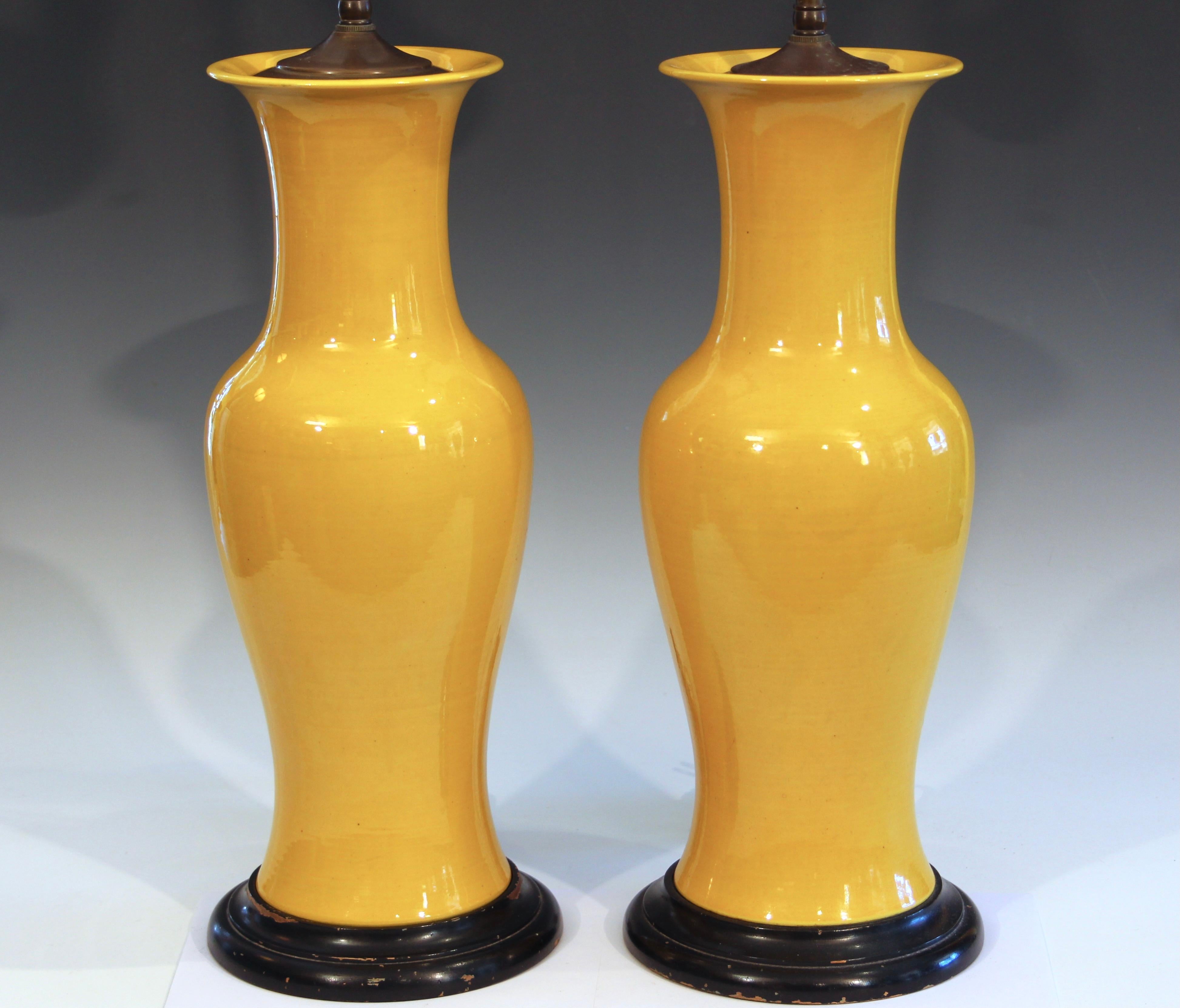 Vintage pair Japanese porcelain yellow monochrome lamps in baluster form with rich yellow crackle glaze, circa 1970's. Nice quality, heavy, double articulated sockets. 30