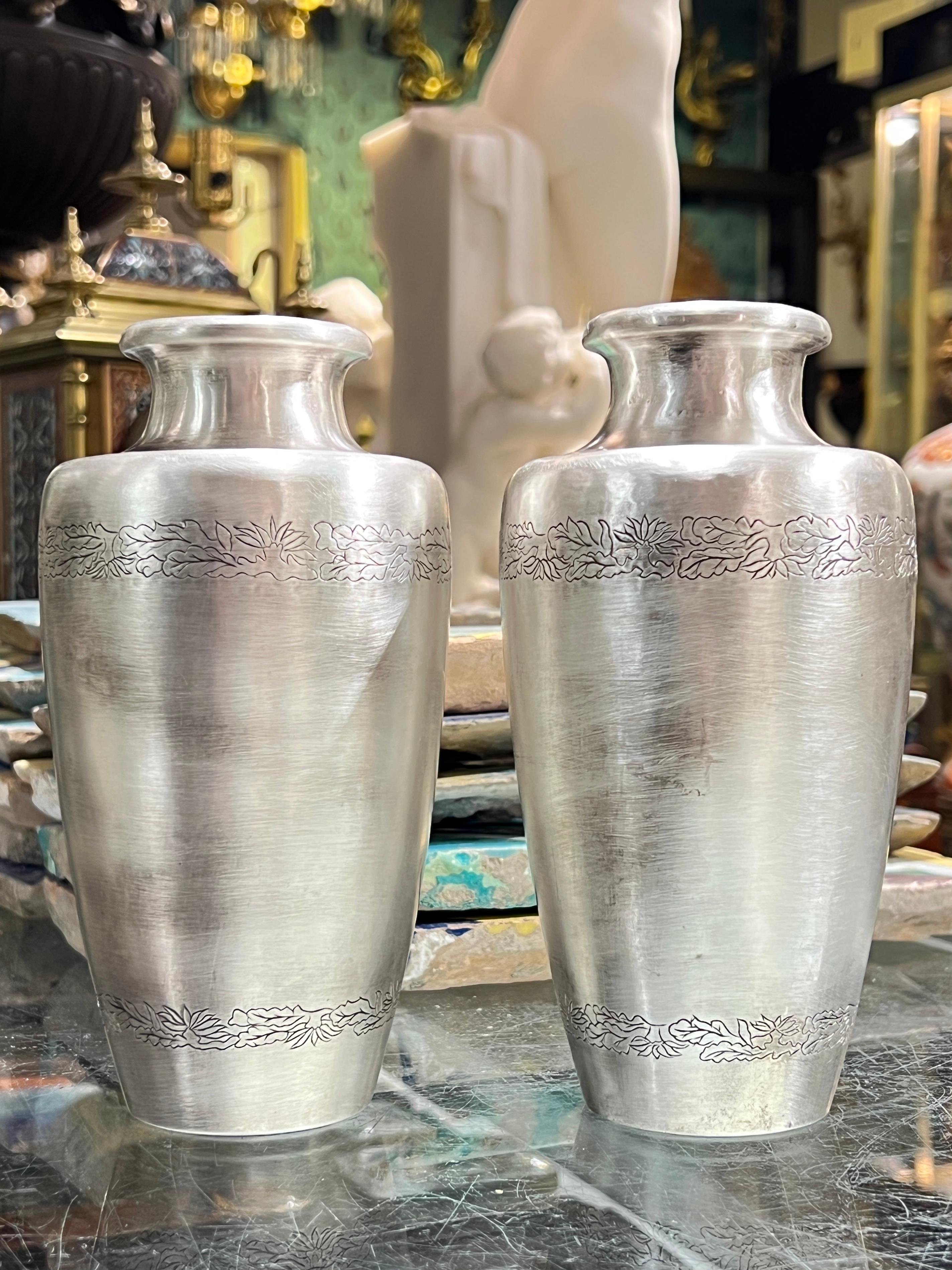 Pair of vintage Japanese vases in sterling silver, 3.5 by 7 inches, gold washed imperial Japanese seal, aka the chrysanthemum seal or kikumon, and incised repeated design of flowering vines. Underside wiith the jungin (pure silver) mark.