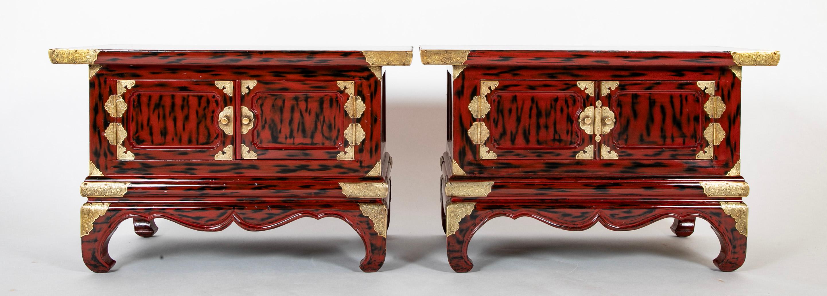 Great looking pair of late Meiji Period Japanese black and red lacquers side tables with etched brass mounts. Each with two doors that open for storage, this stunning pair with really stand out in any decor. Just back from my restorer, refreshed,