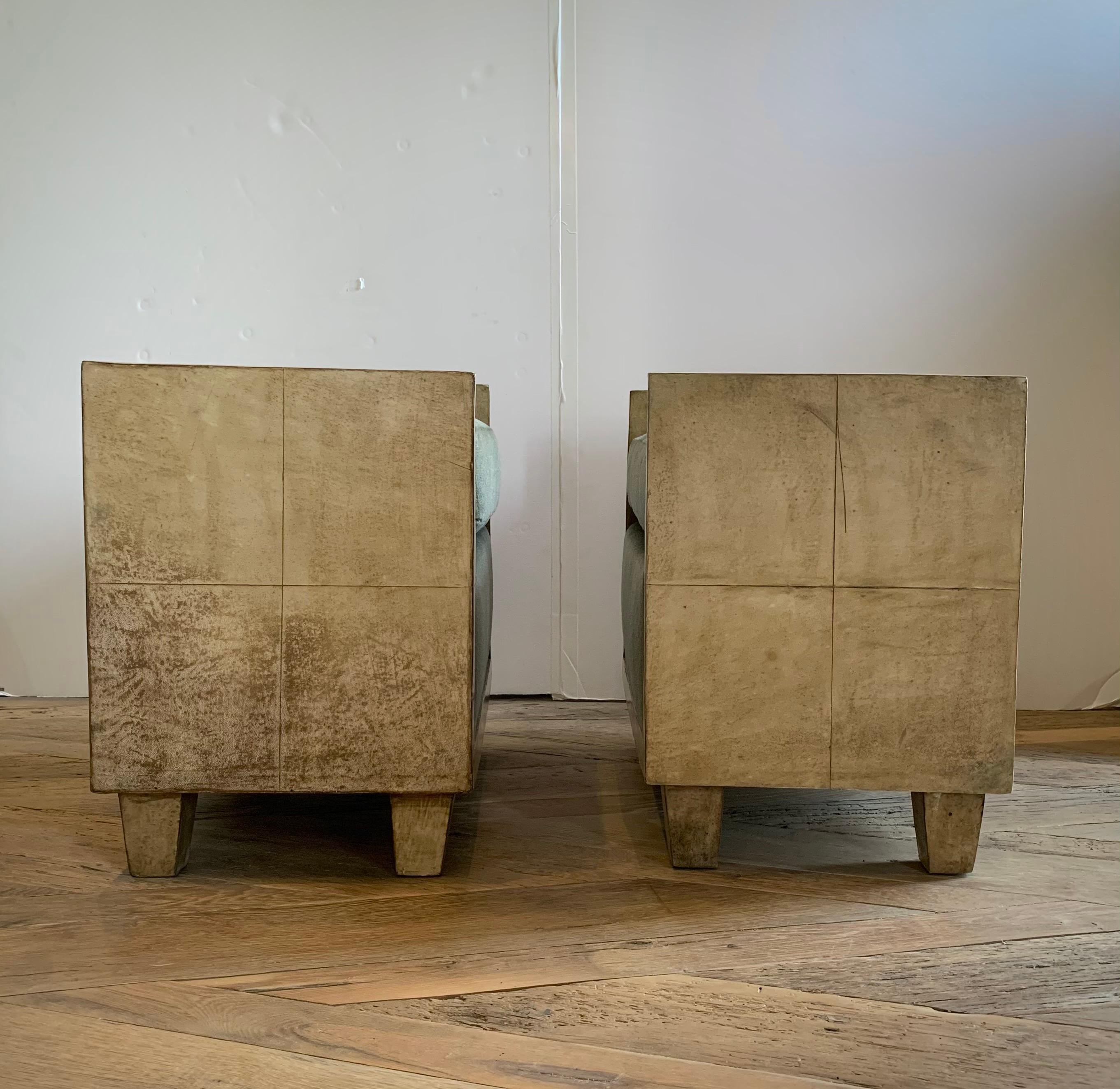 A handsome pair of goatskin parchment Jean-Michael Frank style benches newly upholstered in a greige mohair. Minimalist in design, these seats make a stunning statement to any decor.