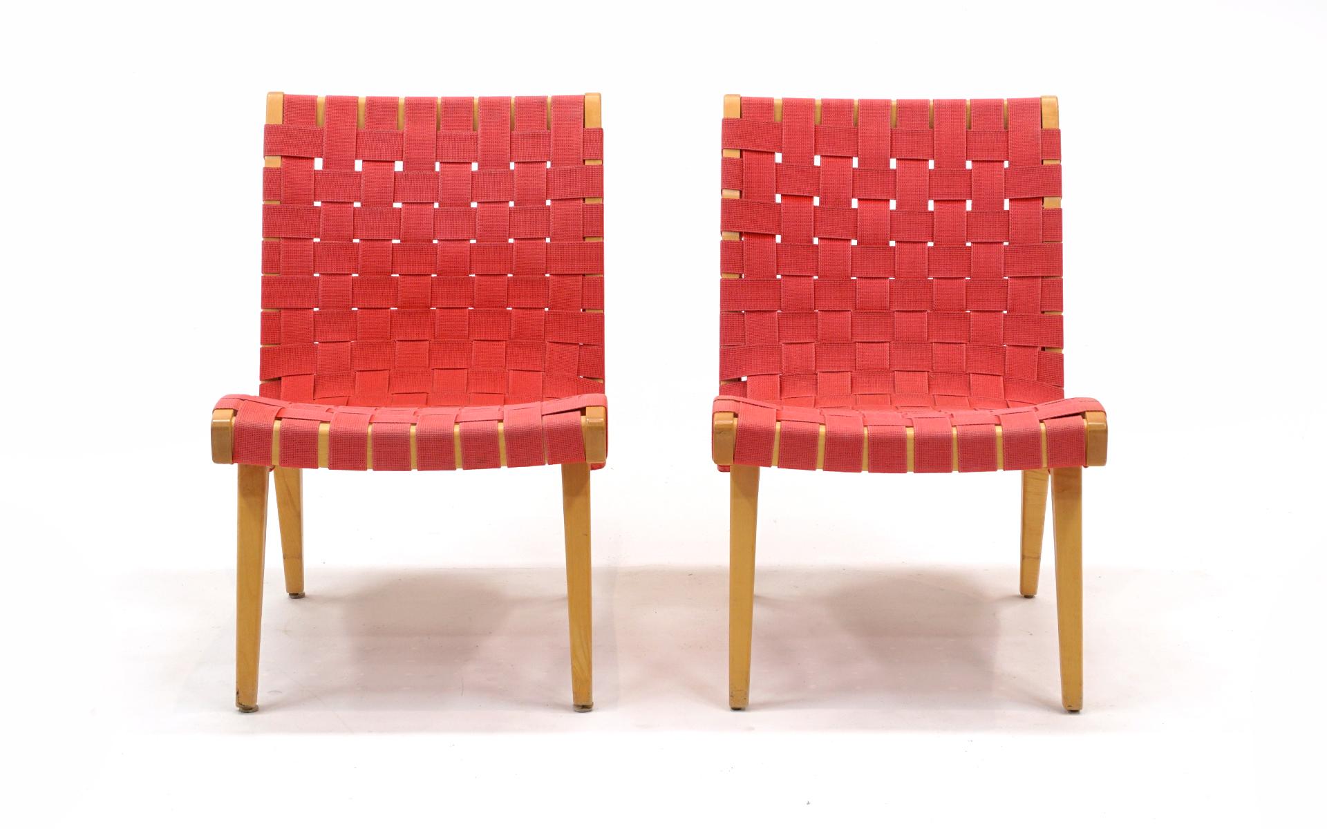 Pair of Jens Risom lounge chairs from his original 1941 design collection for Knoll.  These are more recent production, signed with the Knoll Studio medallion.  These have been used very little but have a fair degree of even sun fading to the