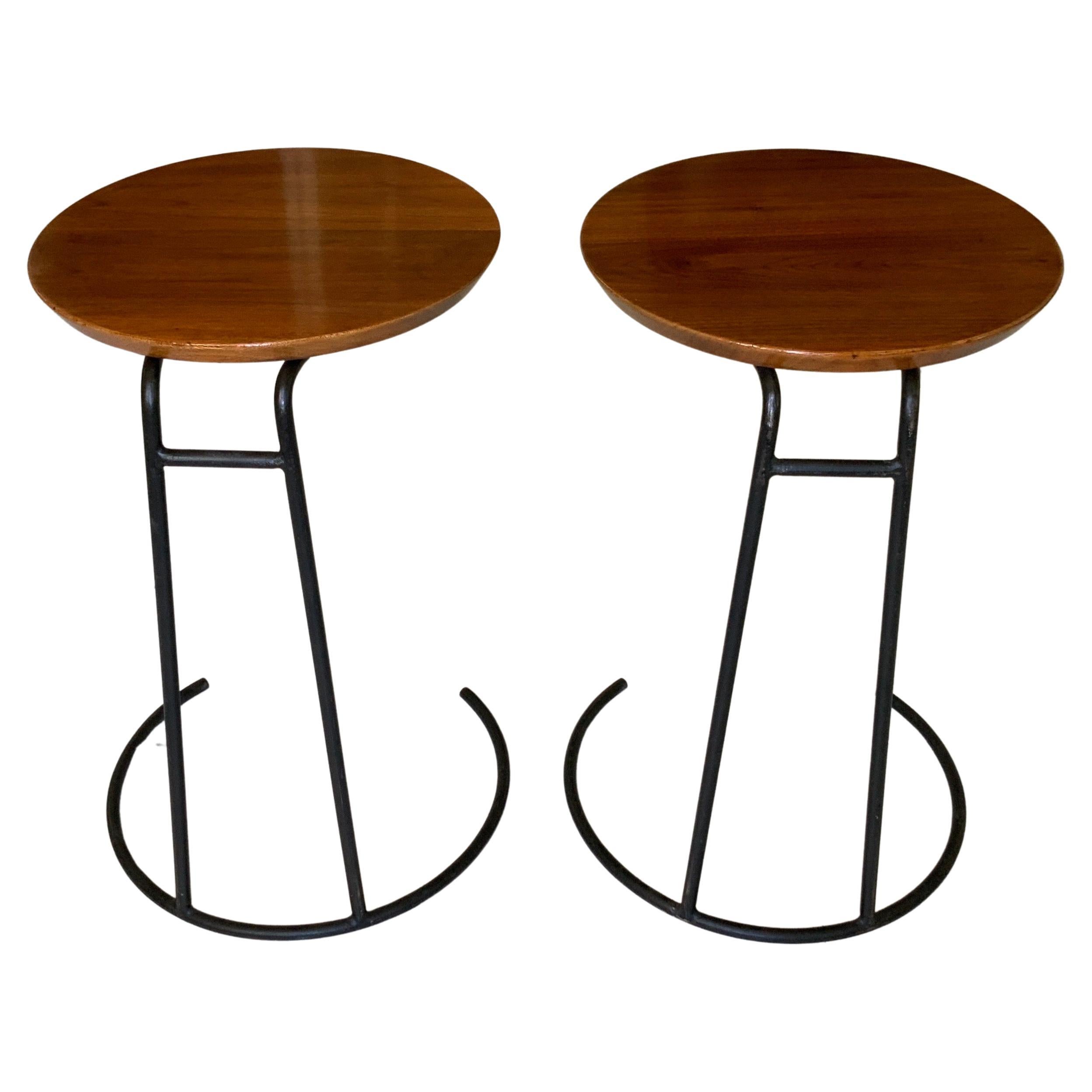 A pair of vintage original uncommon Model T710 walnut wood and lacquered steel from Danish American designer Jens Risom. This set of stackable side tables, circa 1950 have their original labels as well as original rubber bumpers in very good shape.