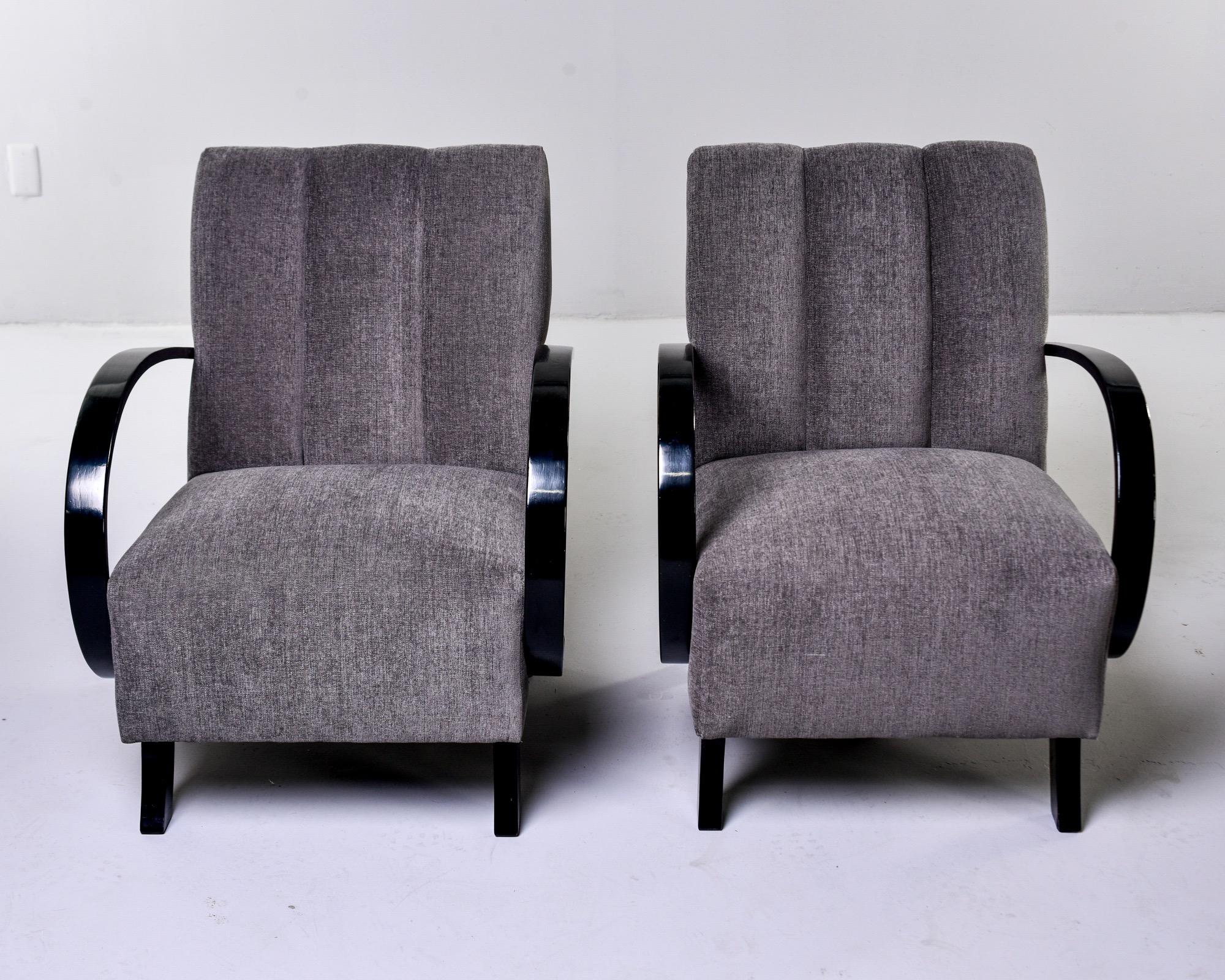Pair of model H237 armchairs designed by Jindrich Halabala, circa 1930s. The frames have a new ebonized finish and the chairs have been reupholstered in a gray chenille velvet. Sold and priced as a pair. 

Measures: Arm height 23” seat height
