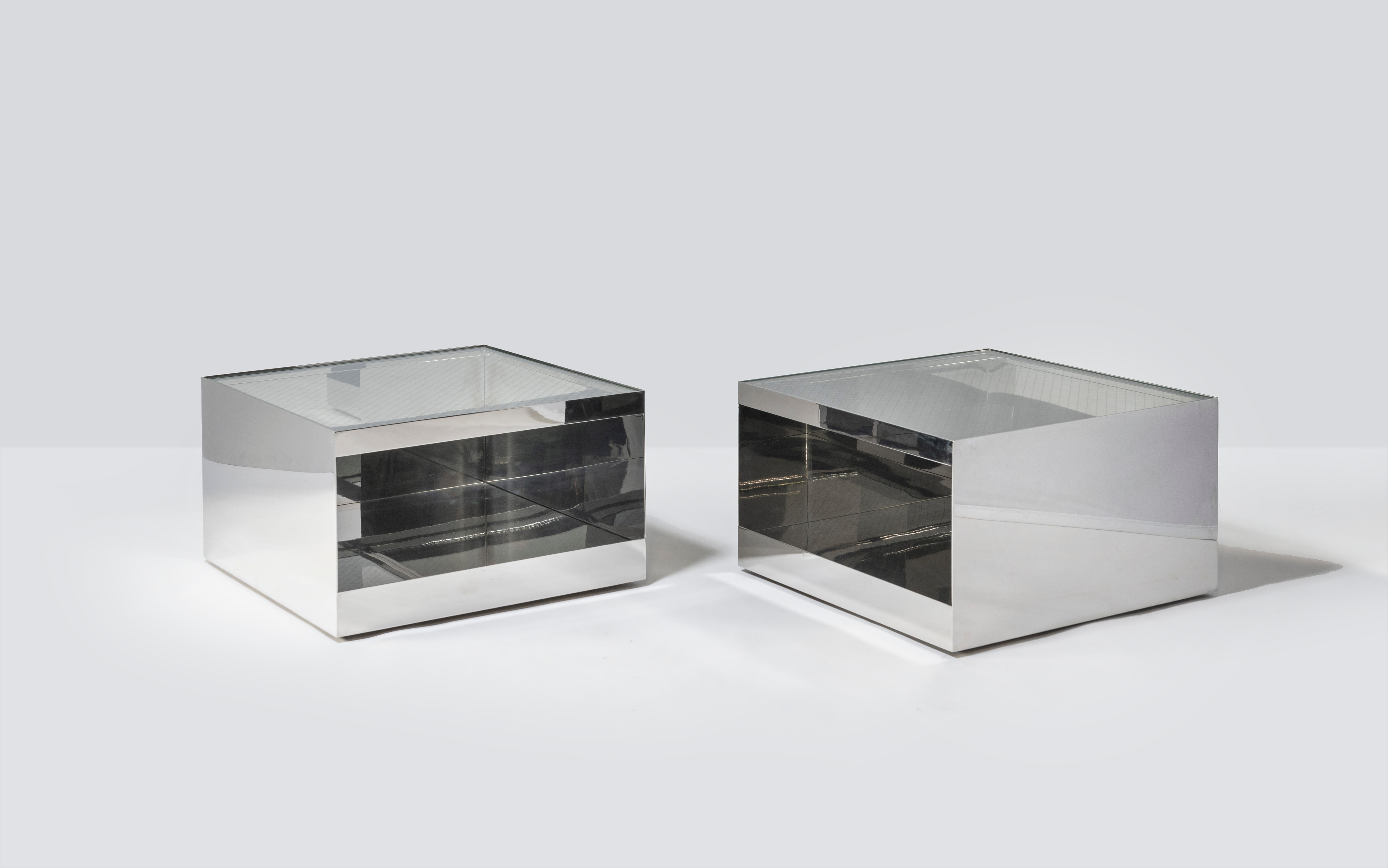 Pair of Joe D'Urso for Knoll steel side tables.

Stainless steel and safety glass tables designed by Joe D’Urso for Knoll. This low rolling table is Model 6027T and is from the Minimalist line D’Urso designed for Knoll in the 1980s.