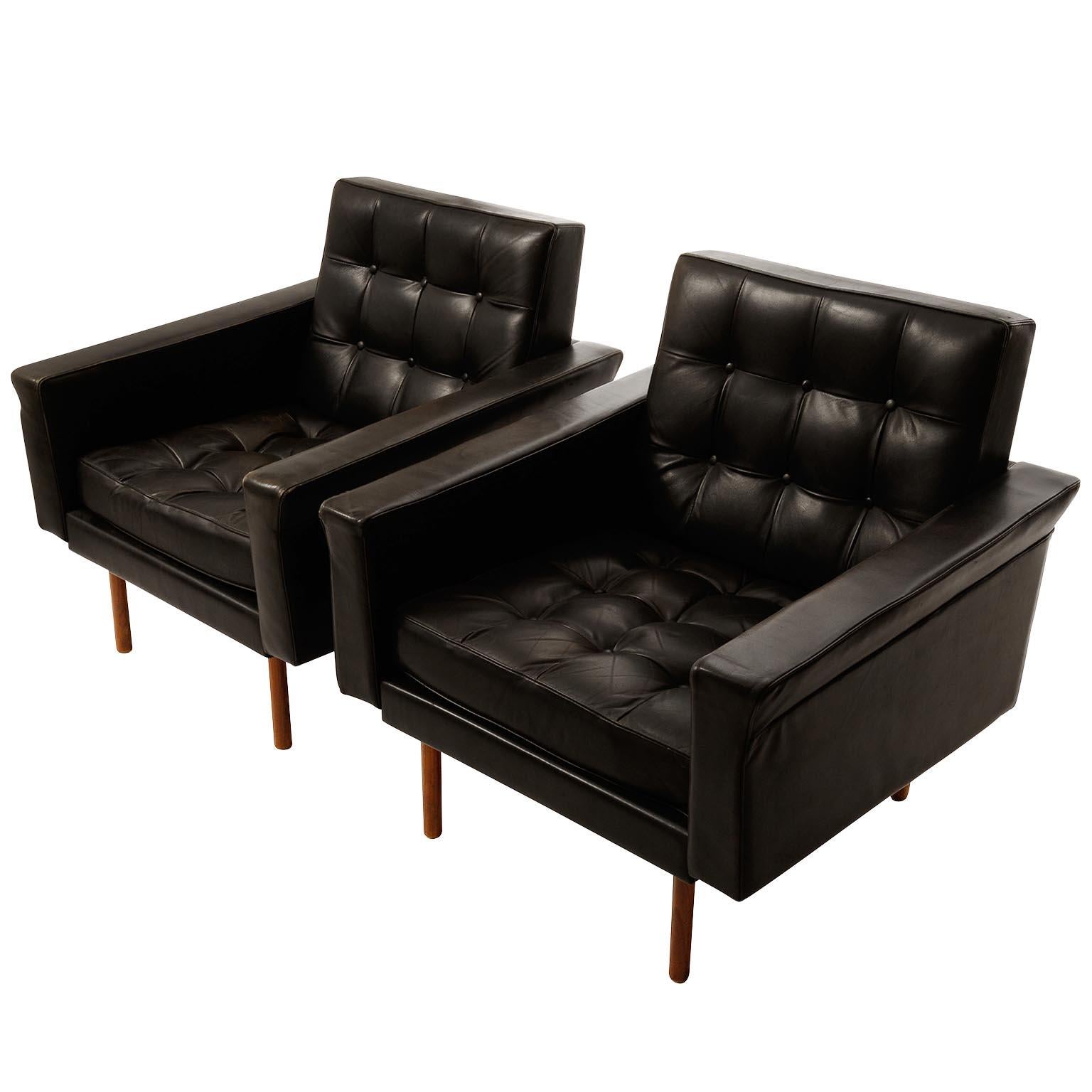 A pair of armchairs with tufted black leather and teak wood legs designed by Prof. Johannes Spalt for Wittmann, Austria, manufactured in midcentury, circa 1960.
The thin legs create the effect of almost free floating pieces.
The chairs are in very