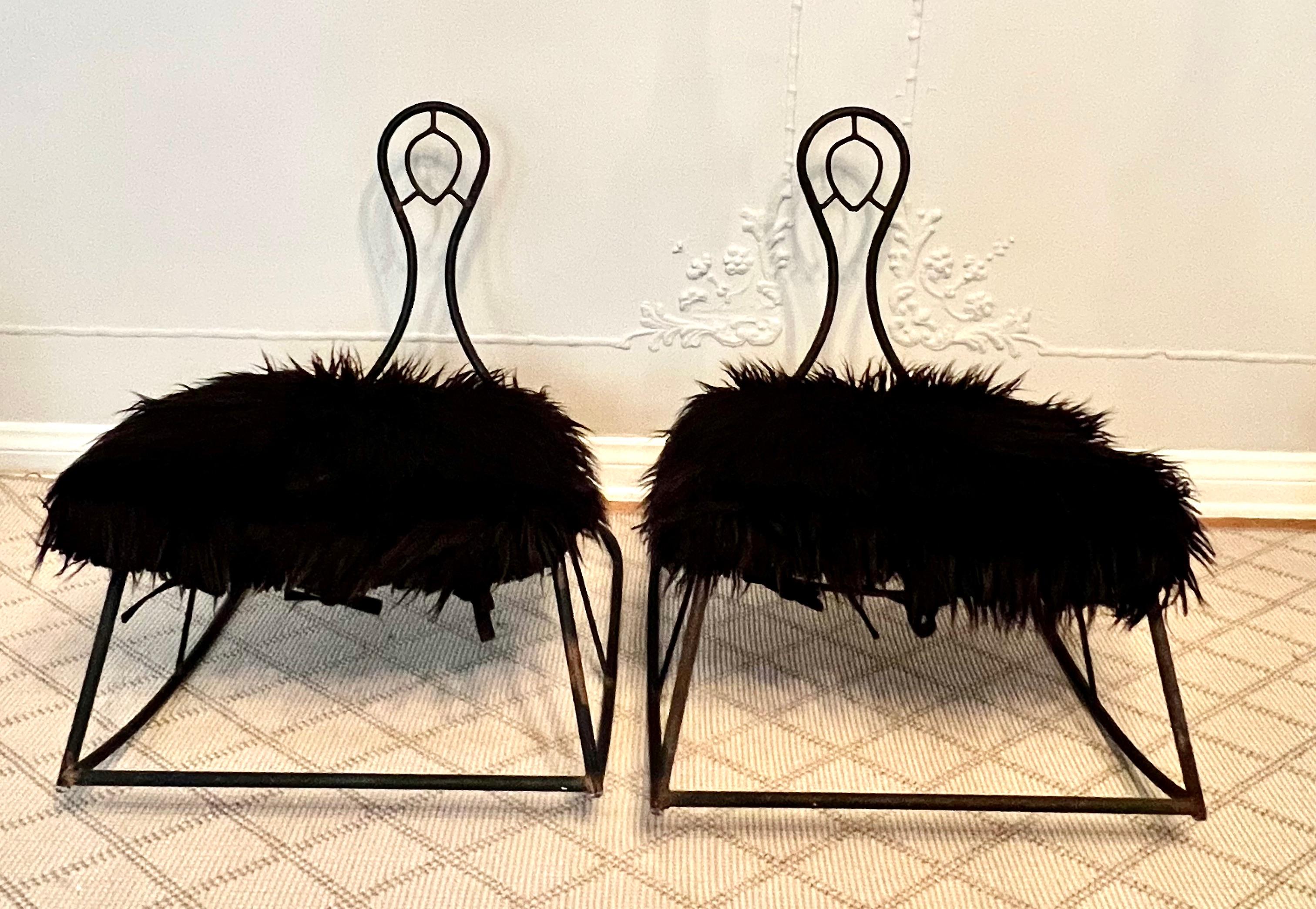 A great pair of metal rockers with a very architectural design and look.  The pair are a compliment to many rooms and would work especially well in a child room or play area.   

The seat cushions are made of faux Mongolian fur and give the rockers