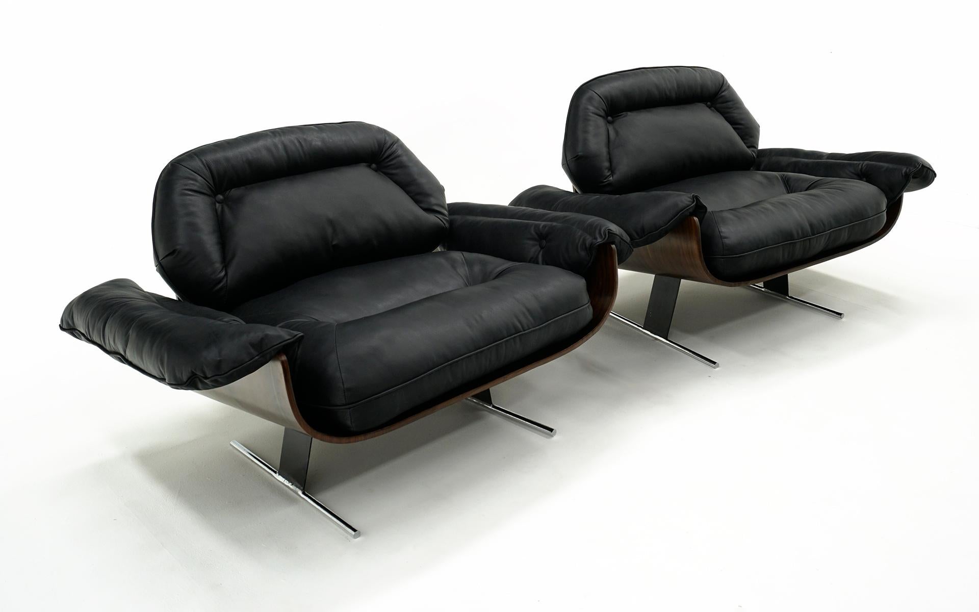 Rare Pair of Jorge Zalszupin Presidential Lounge Chairs.  Brazilian Rosewood frames with the original black leather cushions in very good condition.  No holes, tears or repairs.  Minor wear overall with no distractions.  These are great examples of