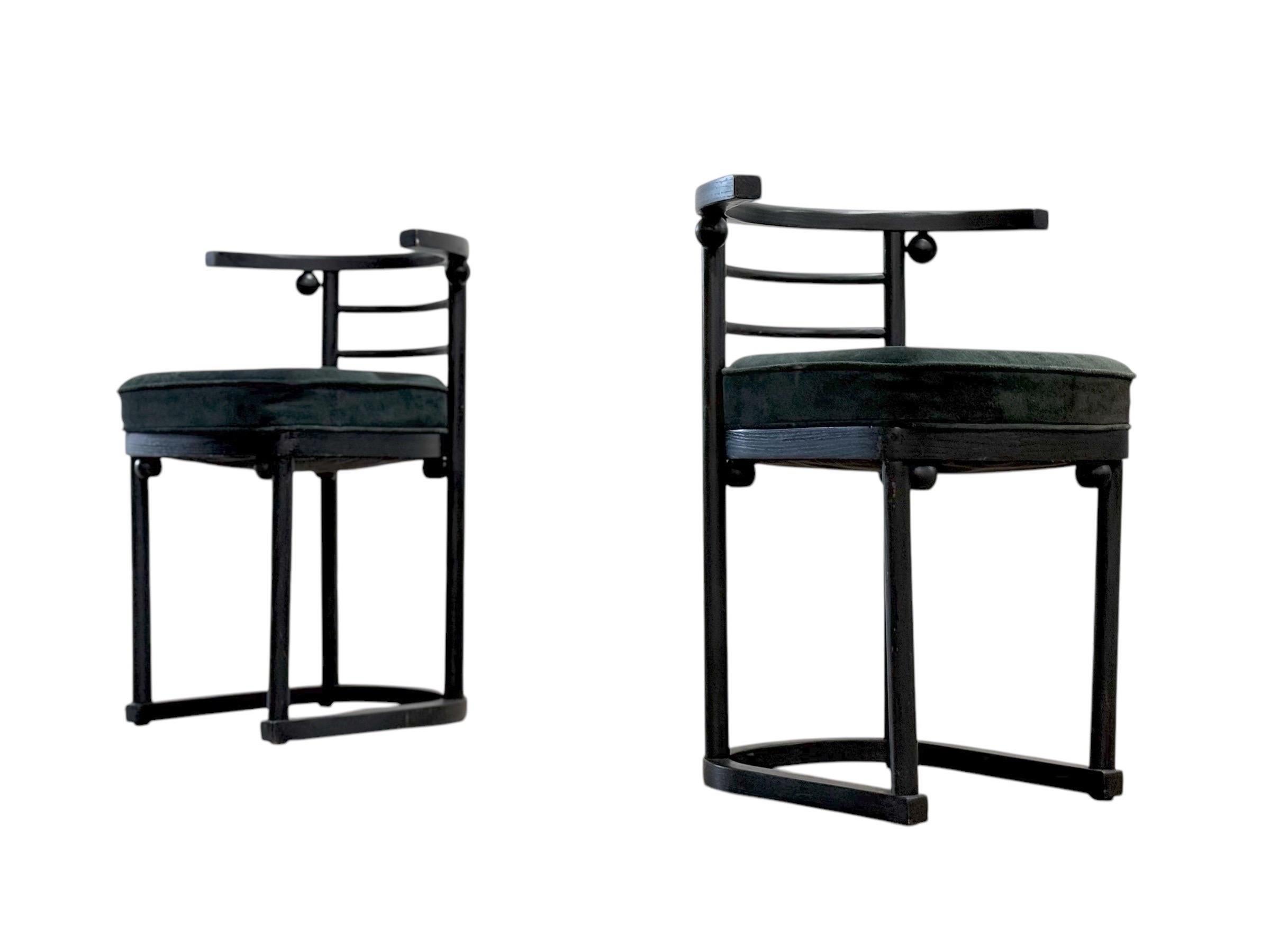 Pair of Fledermaus dining chairs designed by Joseph Hoffman for the Café Fledermaus in 1907, this pair was made by Thonet. The frames are ebonized beech and have seats upholstered in a forest green suede.

Very good original overall condition with