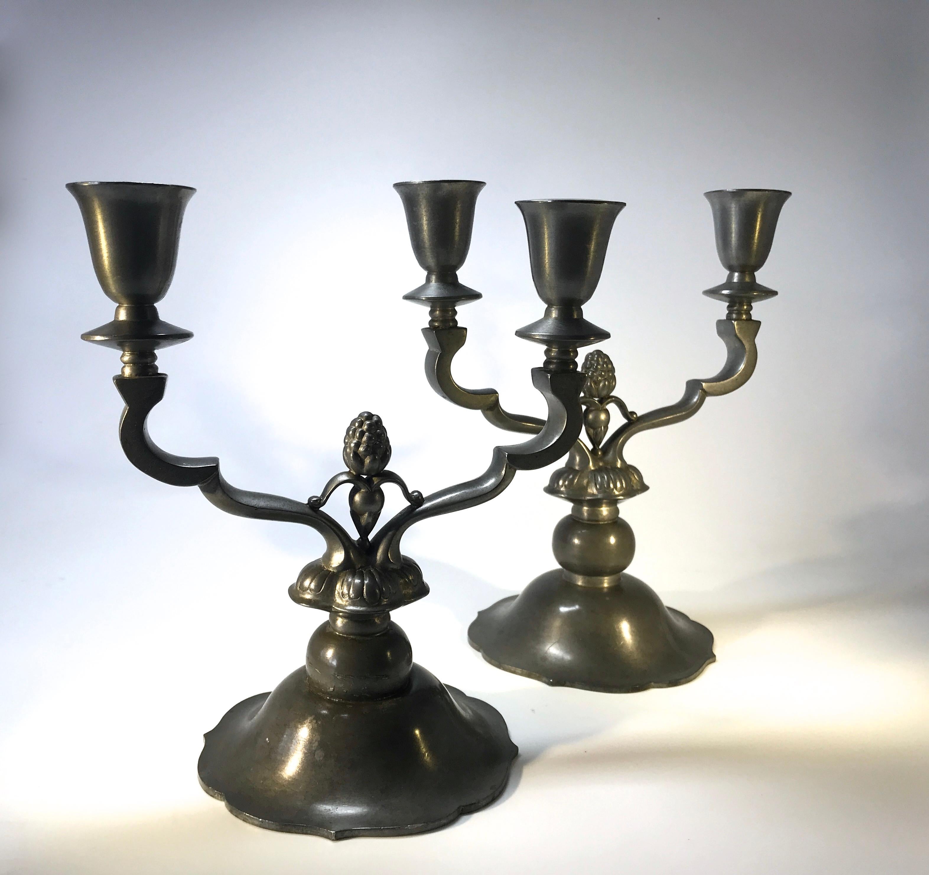A superb pair of Just Andersen, Denmark Scandinavian Art Deco pewter stylised candelabra
Noteworthy shape and size, one slightly taller than the other
Circa 1930's
Stamped and numbered MT307 on both weighted bases
Candelabra 1. Height 8 inch,