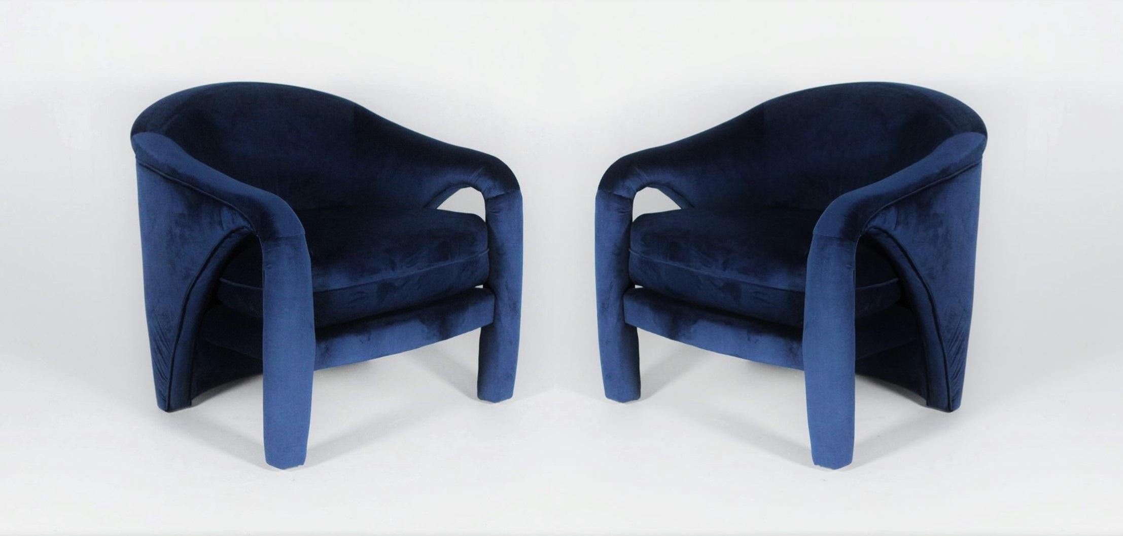 The sculptural lines of these chairs are what rooms are made of a stunning design from all angles. These chairs have been carefully restored and upholstered in a rich blue velvet. Truly a stunning set.
