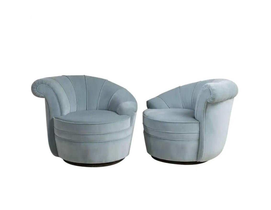 Simply stunning. Pair of nautilus chairs in the style of Vladimir Kagan, perfect for those looking to freshen up their space. Each asymmetrical chair features a sculptural silhouette and a beautifully contoured back. Showcasing thick channels that