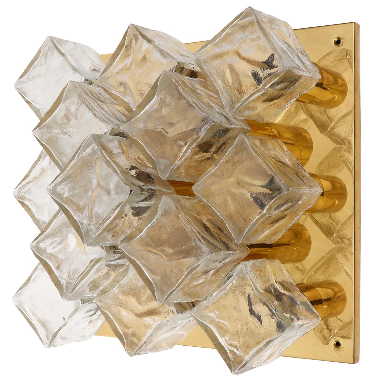 A pair of identical, large and square light fixtures model 'Cubus' (German 'Würfel') by Kalmar, Austria, manufactured in midcentury, circa 1970 (end of 1960s and beginning of 1970s).
Two pairs are available.
They are made of polished brass and