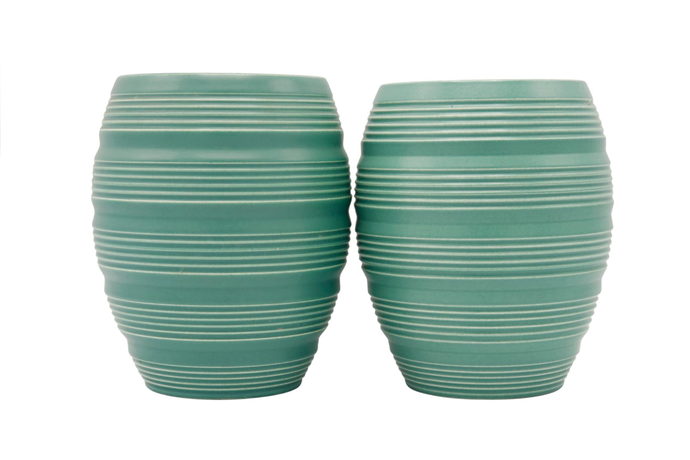 Unique shape and Keith Murray's traditional green glaze. Pair of deco inspired ribbed vases.