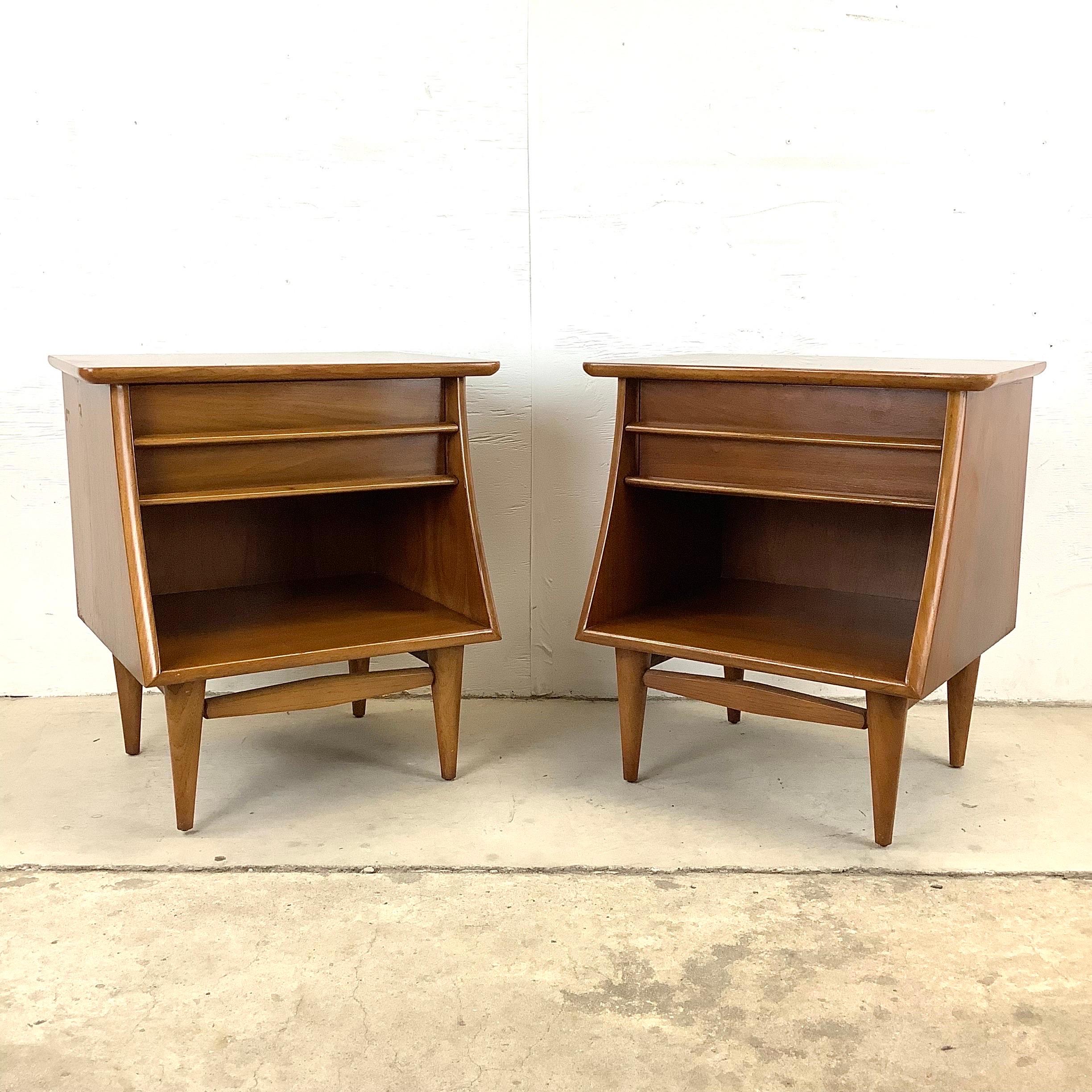 The simple yet stylish mid-century design of these matching walnut nightstands uses clean modern lines, sculptural wooden drawer pulls, and a vintage walnut finish to make these the perfect addition to any interior. From the Kent Coffey “Foreteller”