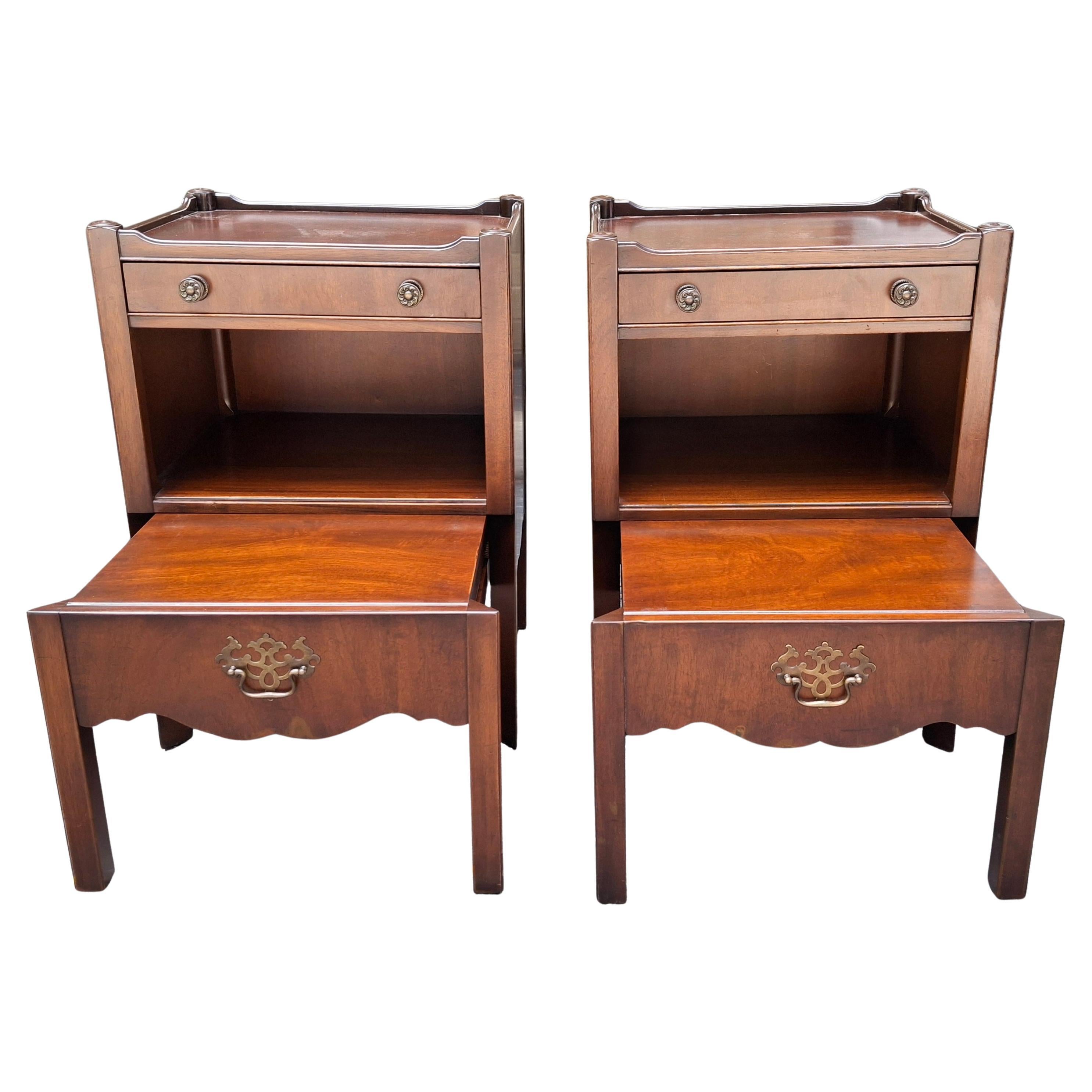 A newly,  fully restored Pair of Kittinger Furniture Mahogany Nesting / Sliding Step Bedside tables. 
Measures 20