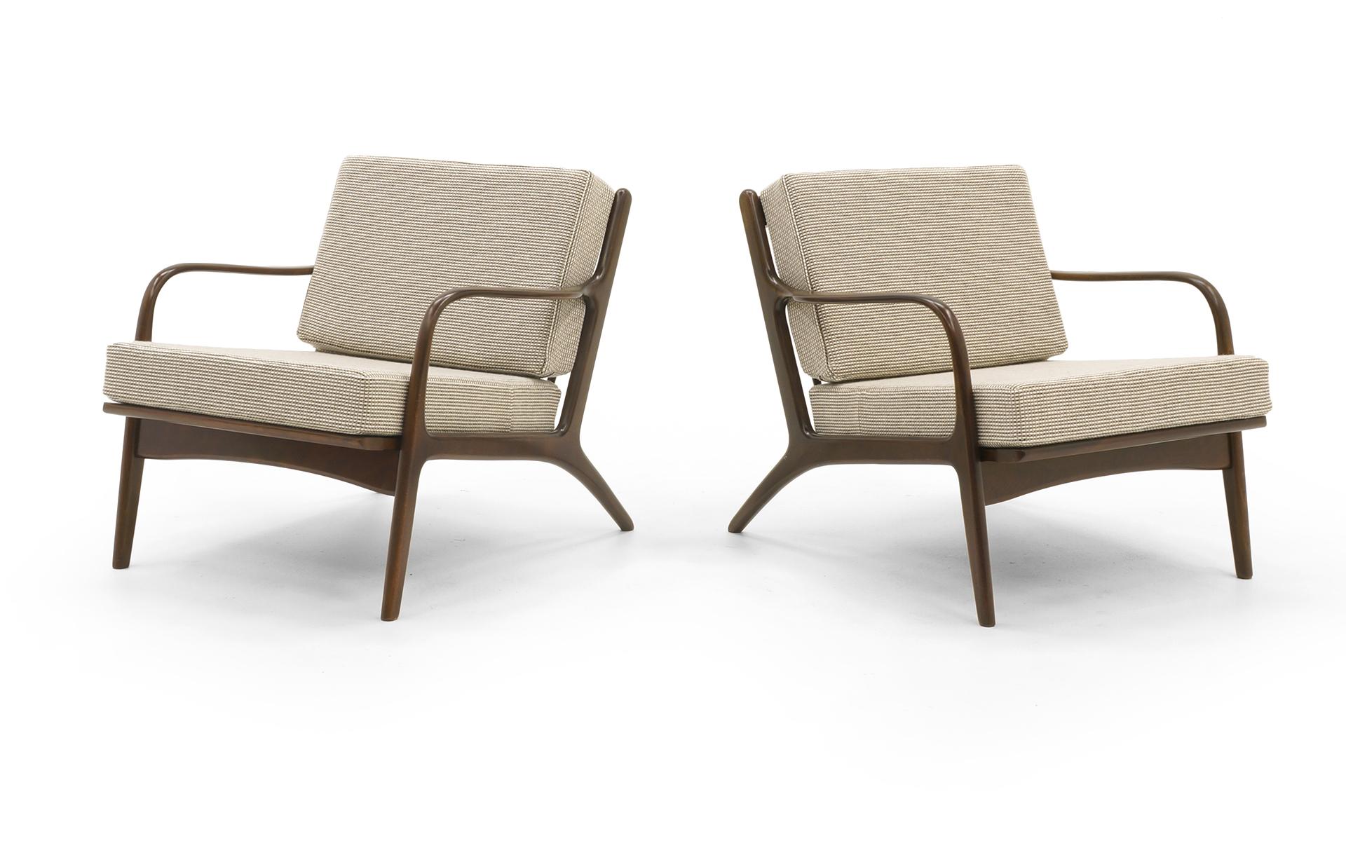 PRICE IS FOR THE PAIR.  Pair of Danish modern lounge chairs by Kofod-Larsen, Denmark, 1950s. Beech frames with neutral color, slightly nubby, very soft and comfortable Knoll fabric. Cream, beige or off white. Expertly refinished and restored. Like