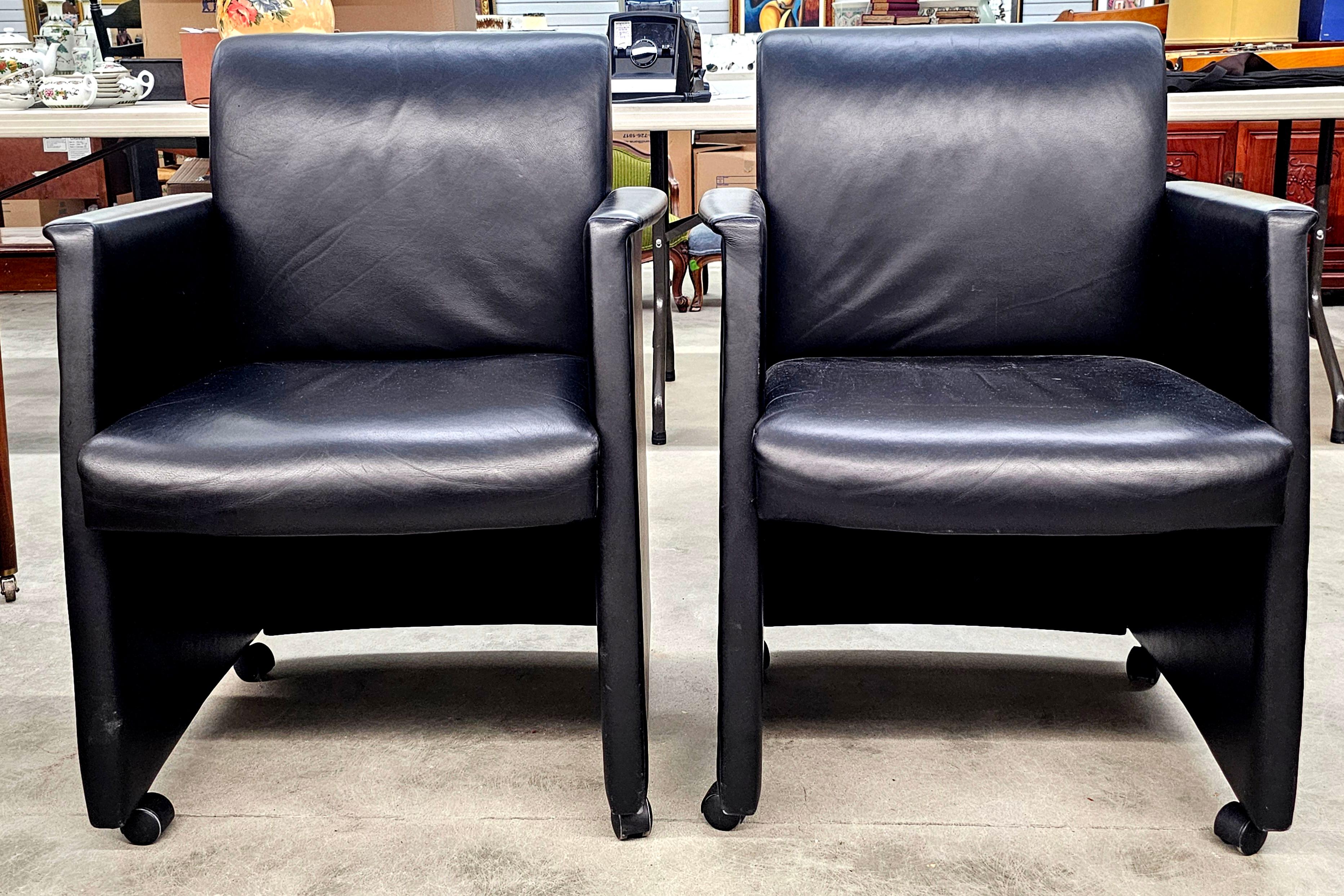 Pair of Kron USA Black Leather Guest Rolling Armchairs
 Measures 26