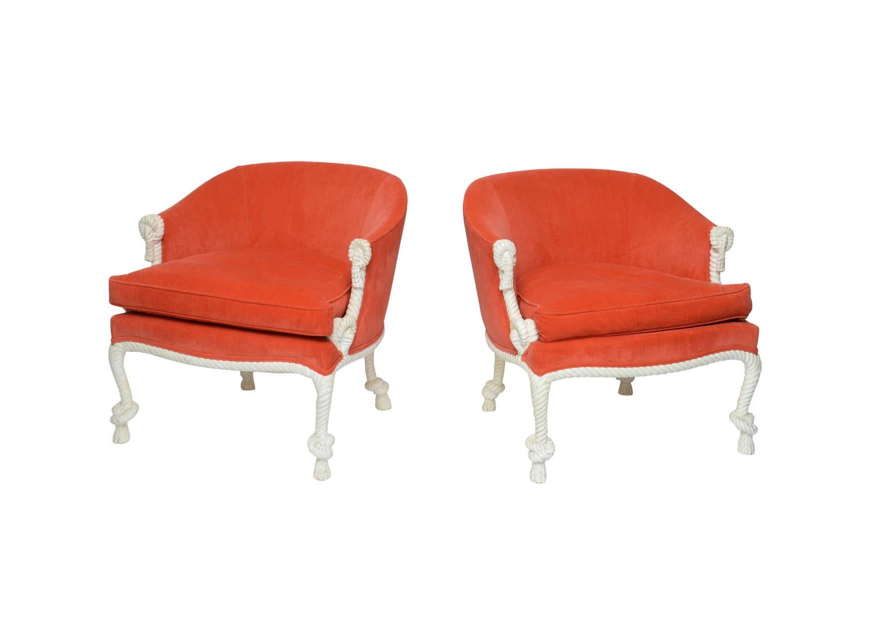 Beautiful pair of carved rope and tassel Napoleon III style armchairs. Features a solid carved wood barrel back lacquered wood frames, luxurious orange colored velvet upholstery. 

The illusion of twisted and knotted rope is often associated with