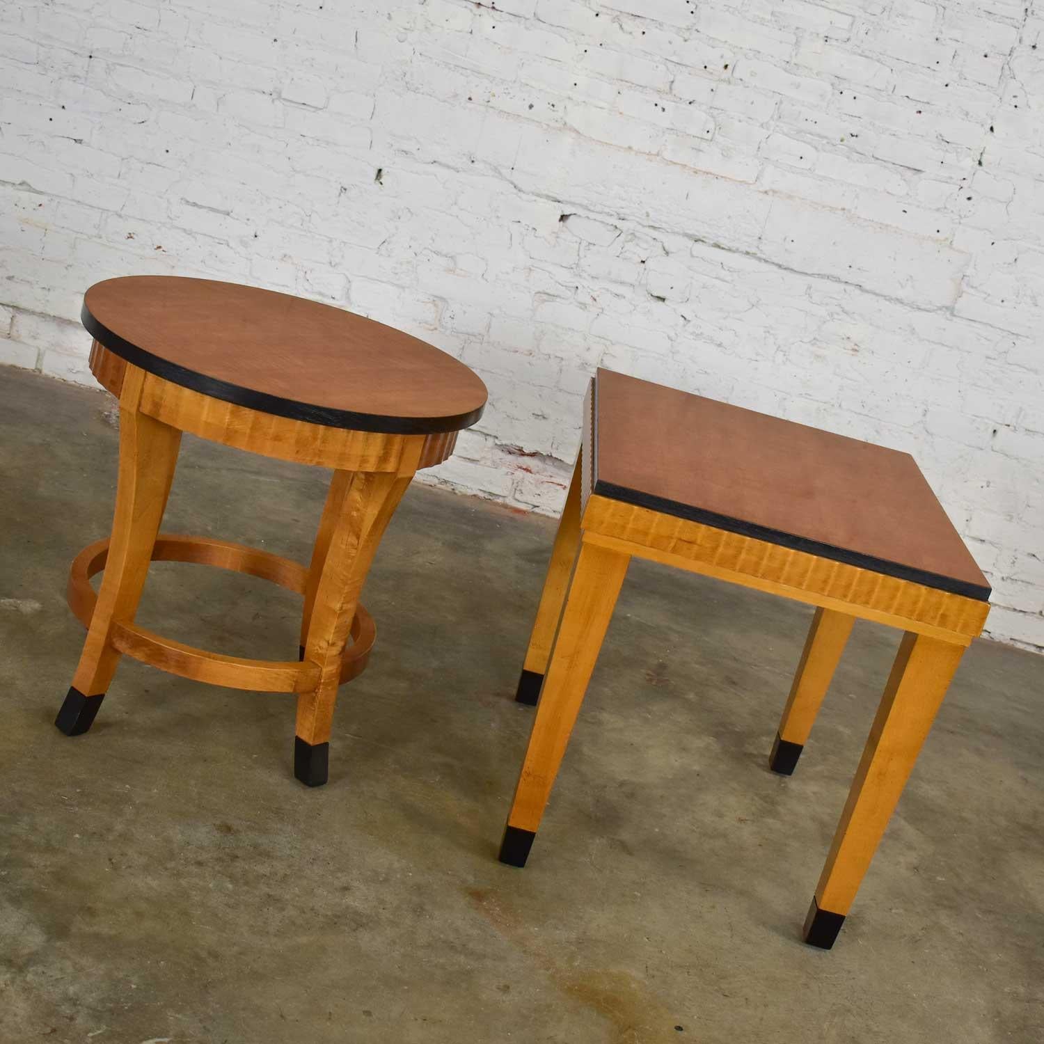 Stunning pair of Lane art deco revival end tables one rectangle and one round. Comprised of beautiful mid-toned wood and black painted accents on edges and sabots. Wonderful condition with a few minor touch ups and age-appropriate wear as you would