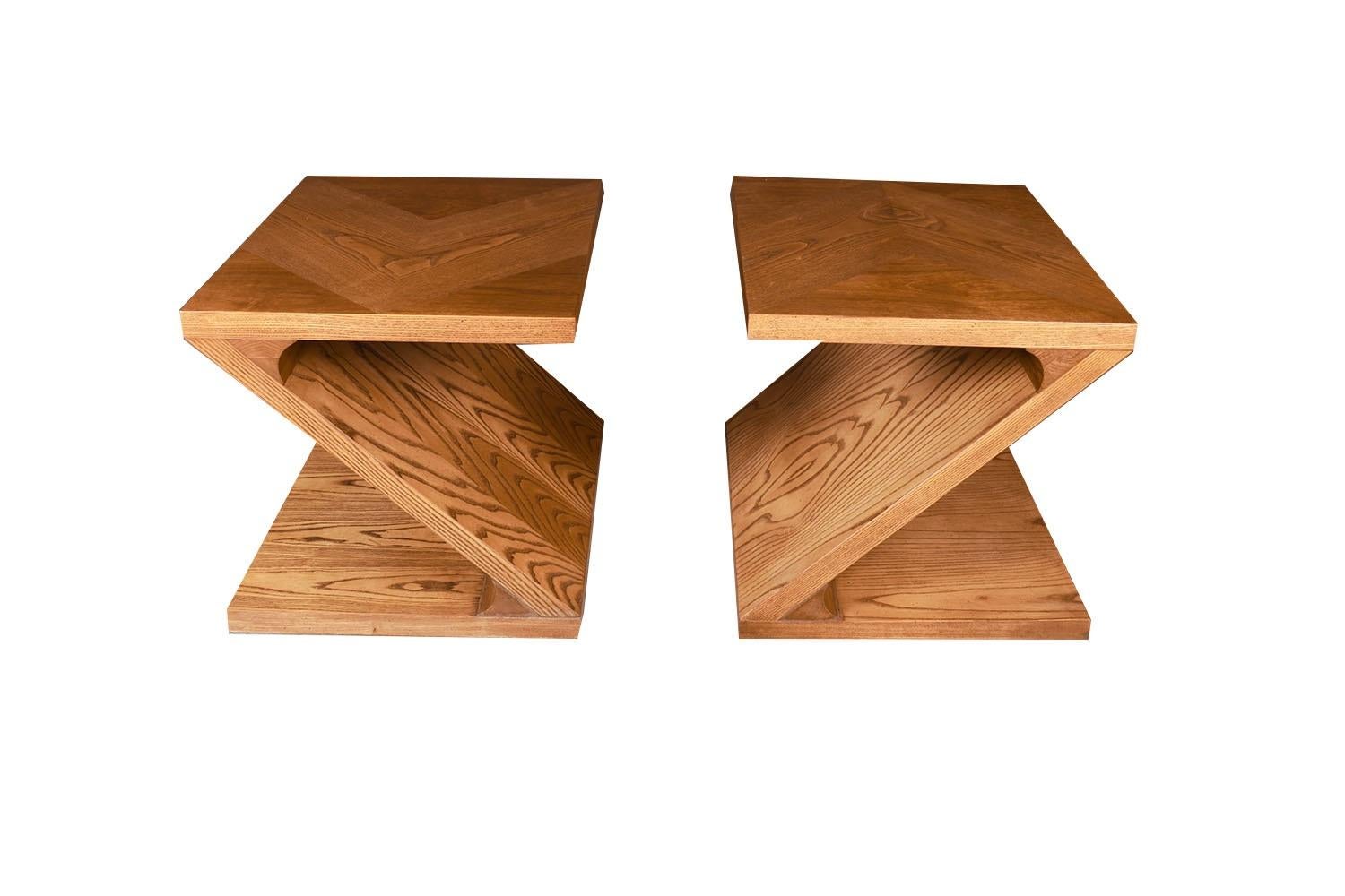 A striking, unique pair of midcentury Modern Z shape end tables or nightstands by Lane Furniture. Multipurpose tables each feature a single piece of graceful z design with beautiful oak marquetry throughout and a thick 1 5/8