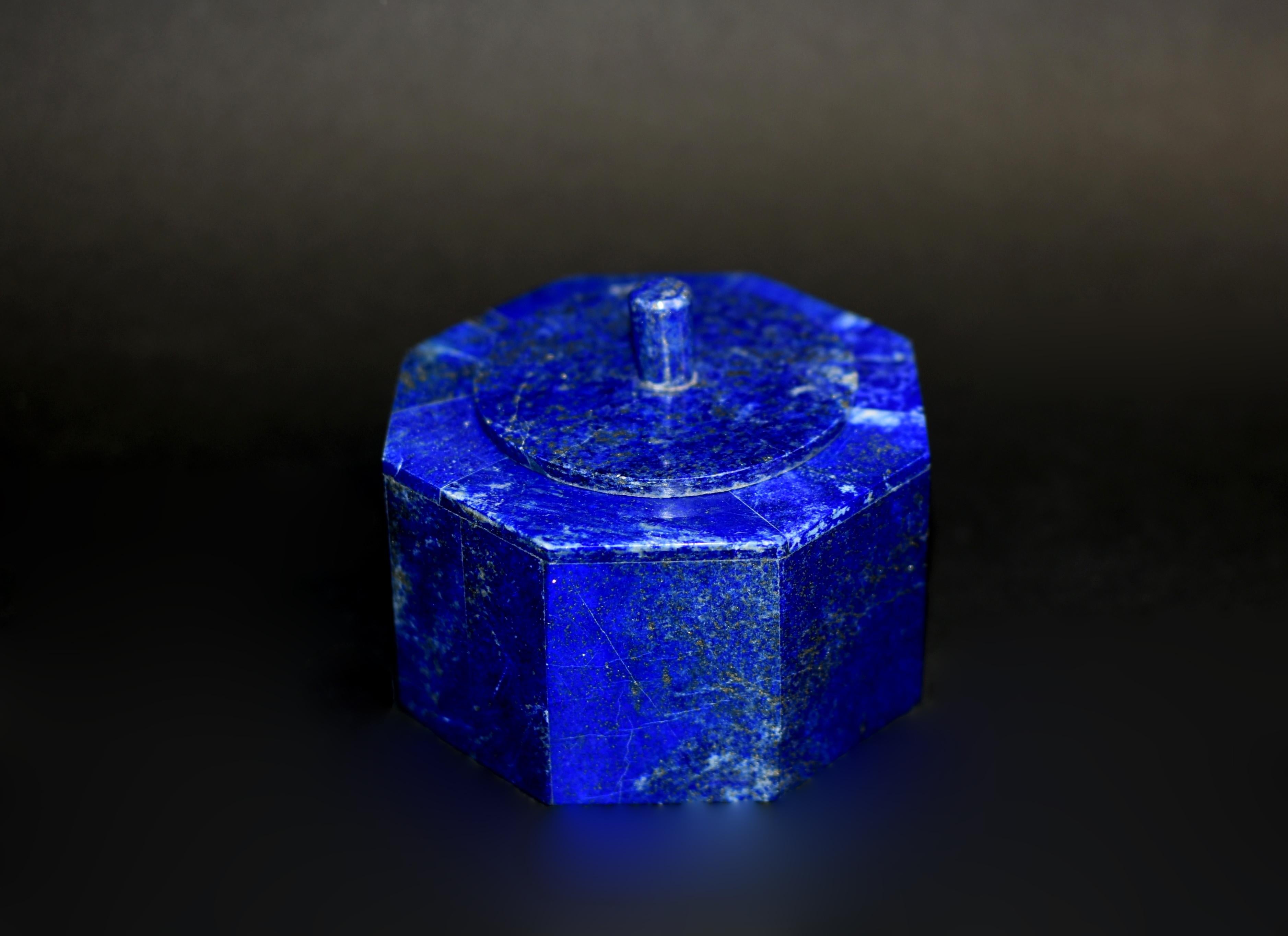 Beautiful 2.2 lb octagonal boxes made of the finest, grade AAA natural lapis lazuli.. Round lid with elegant finial and fine carrara marble interior. High percentage of Lazurite mineral gives the boxes the stunning, saturated blue color. Beautiful