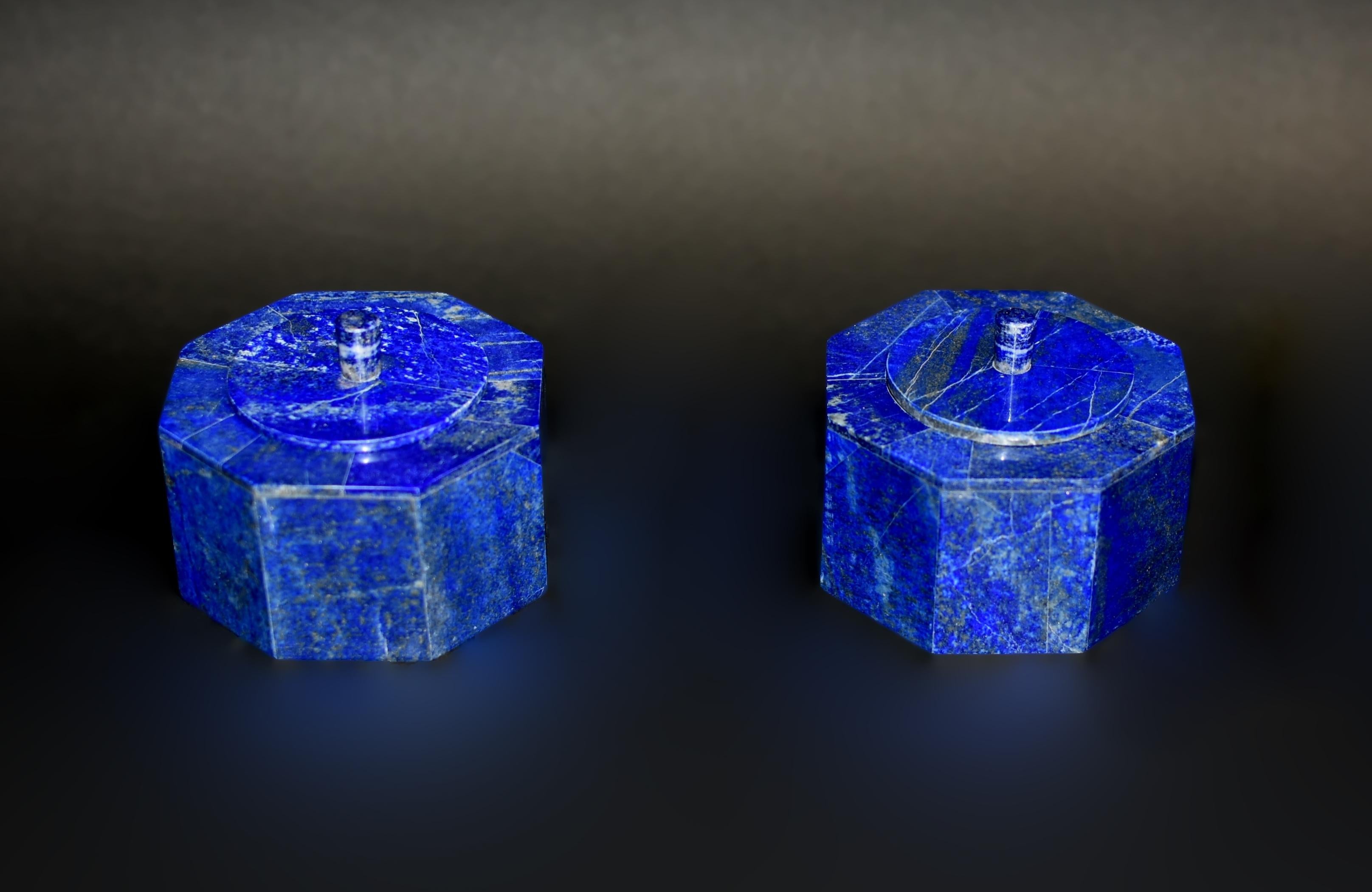 Beautiful 2.4 lb octagonal boxes made of the finest, grade AAA natural lapis lazuli.. Round lid with elegant finial and fine carrara marble interior. High percentage of Lazurite mineral gives the boxes the stunning, saturated blue color. Beautiful
