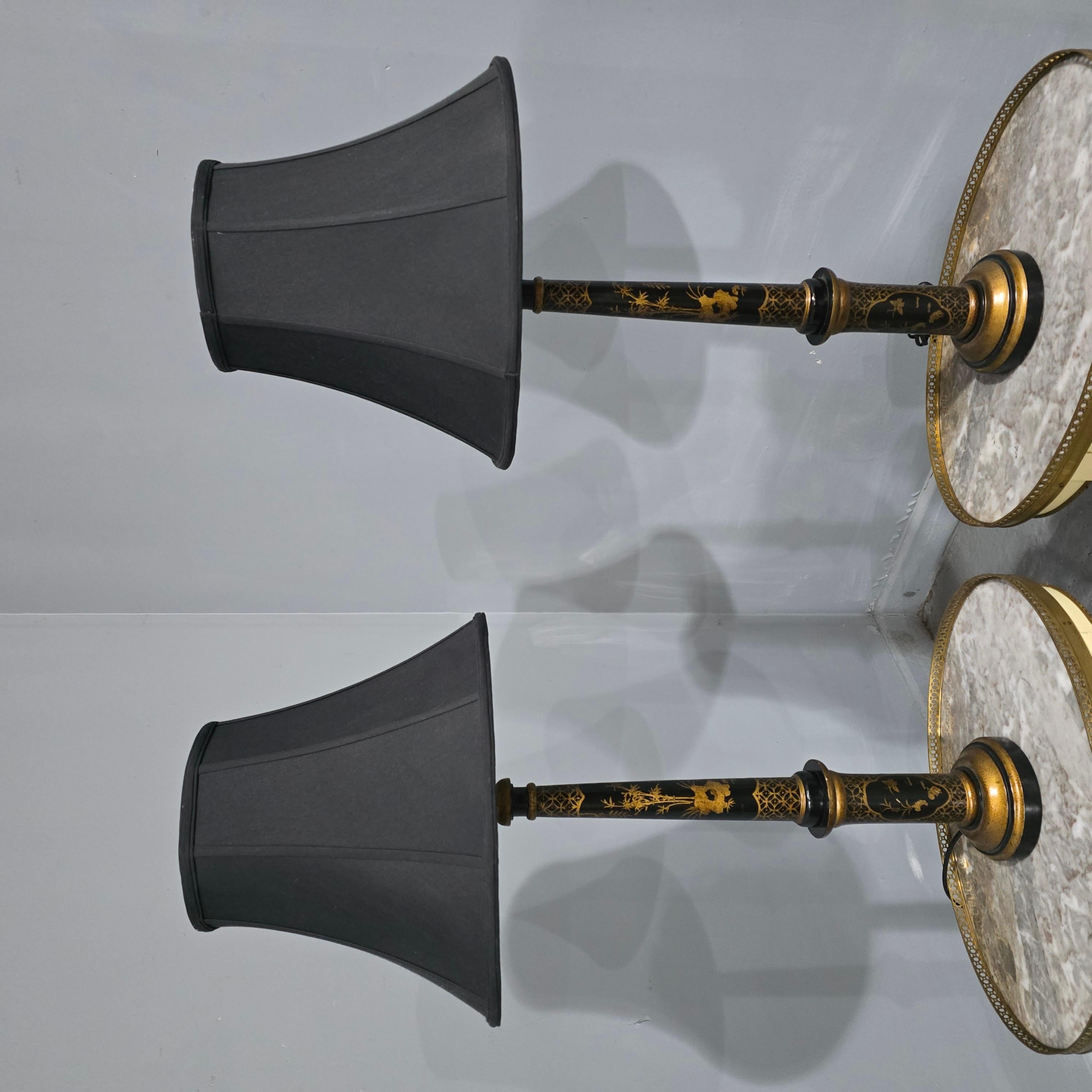 Very good pair of black laquered and gilded tall table lamps with black shades (optional), in very good original condition.

27