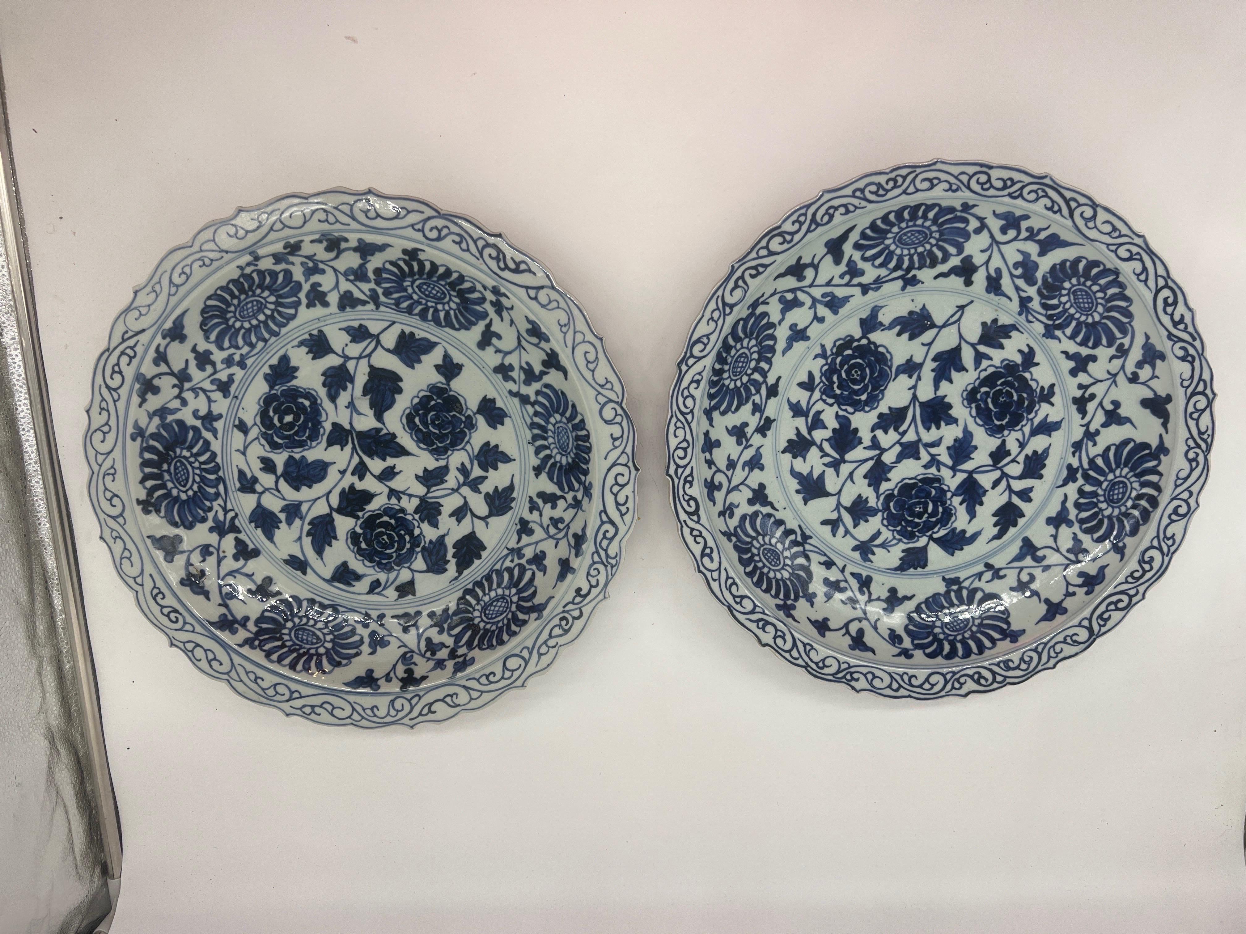 Pair, Large 14.75” Chinese Blue & White Porcelain Floral Platters.
A pair of very large Chinese porcelain platters decorated in a blue and white underglaze of flowers and vines.