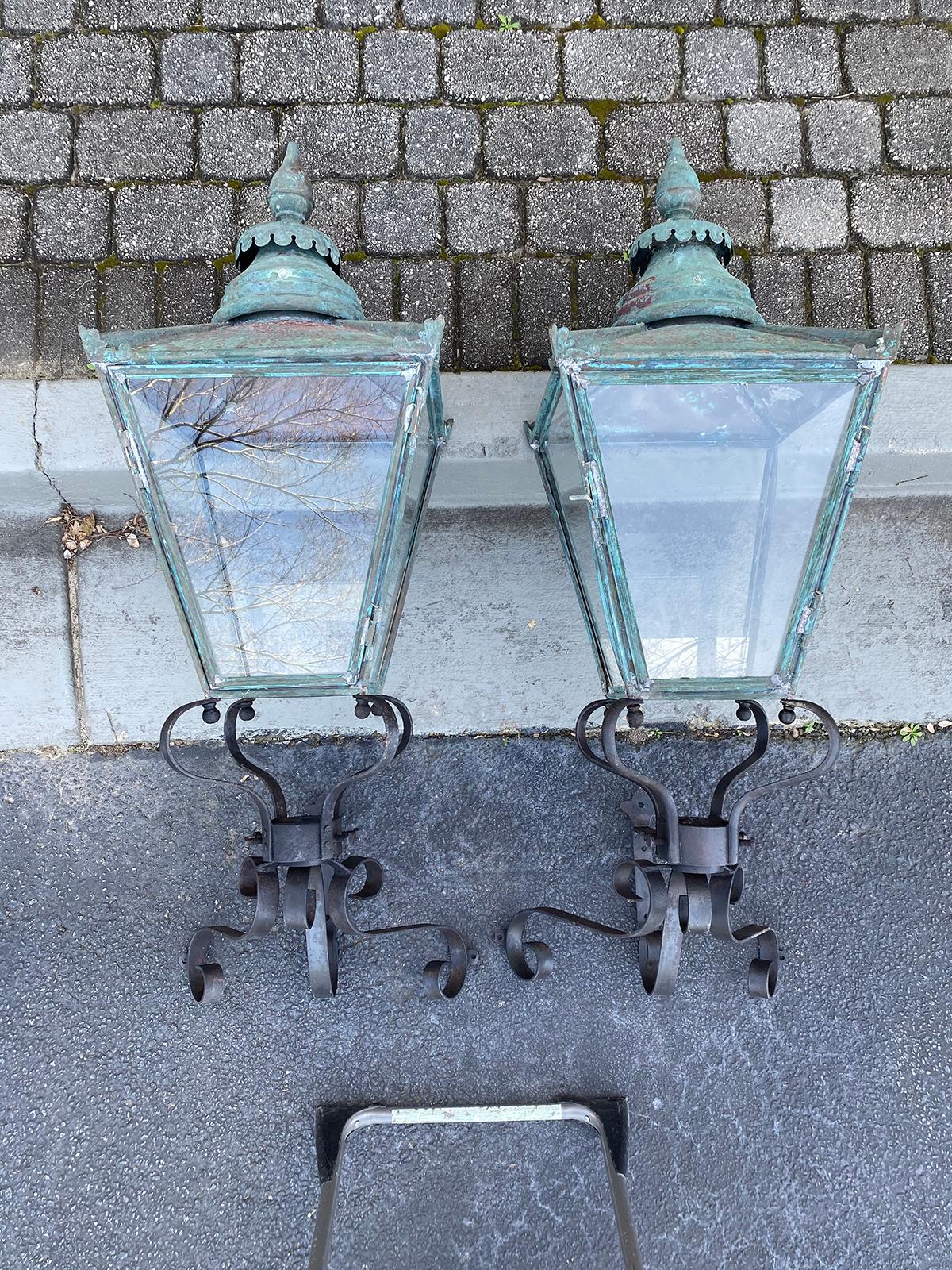 Pair large 19th century English copper wall lanterns with 20th century iron brackets.
Not wired can take gas.