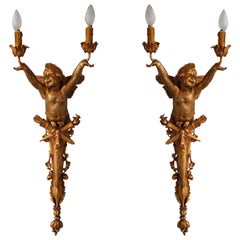 Paire de grandes appliques à 2 éclairages Art Nouveau 1900 en bronze doré avec bébé