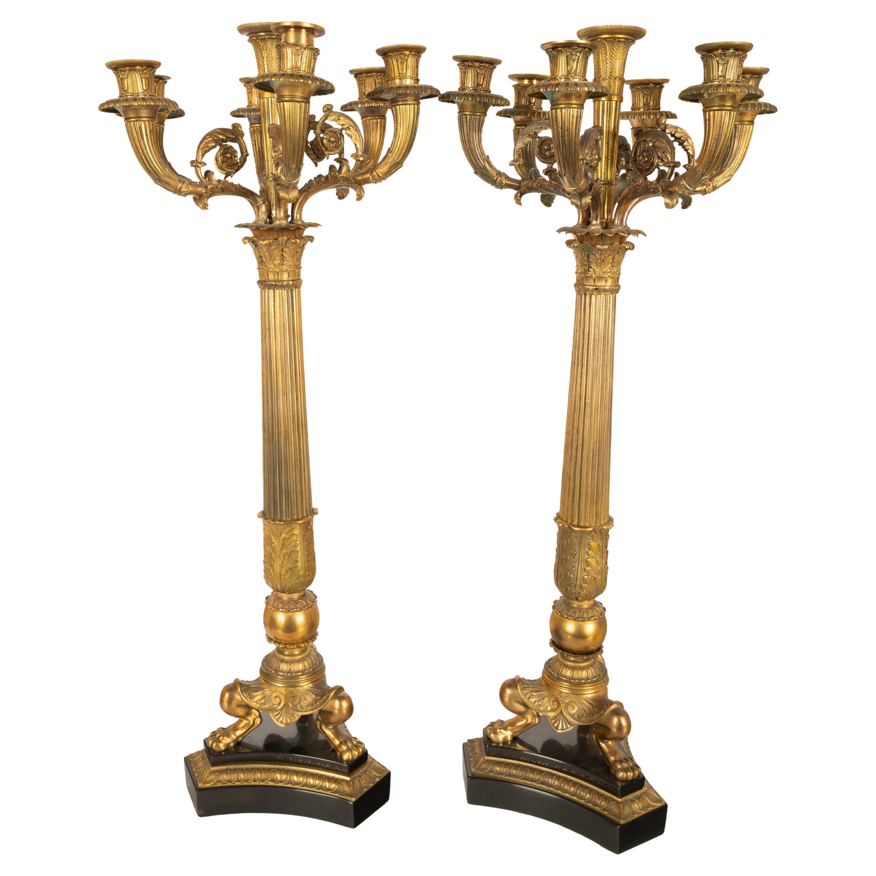 A very fine pair of antique French Restoration Period seven branch black marble & gilded bronze candelarbra, attributed to Pierre-Philippe Thomire, (1753-1843), circa 1815.
Each candelarbra with a central trumpet shaped ribbed & engraved leaf