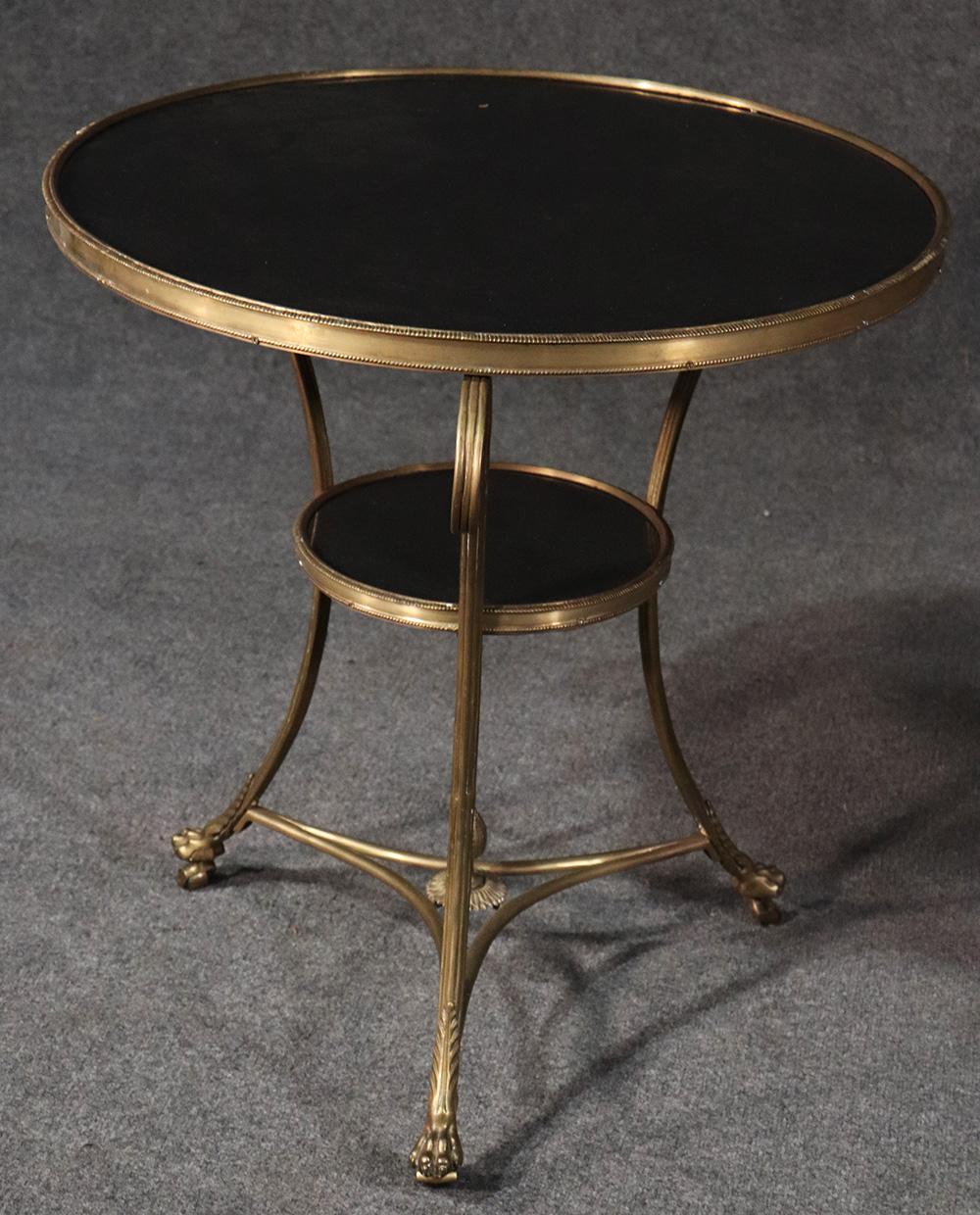 These are exceptional! This wonderful pair of tables is made of the finest quality and heaviest possible bronze possible with beautiful casting quality and detail. The paw feet and deep black marble tops are in flawless condition and so clearly the
