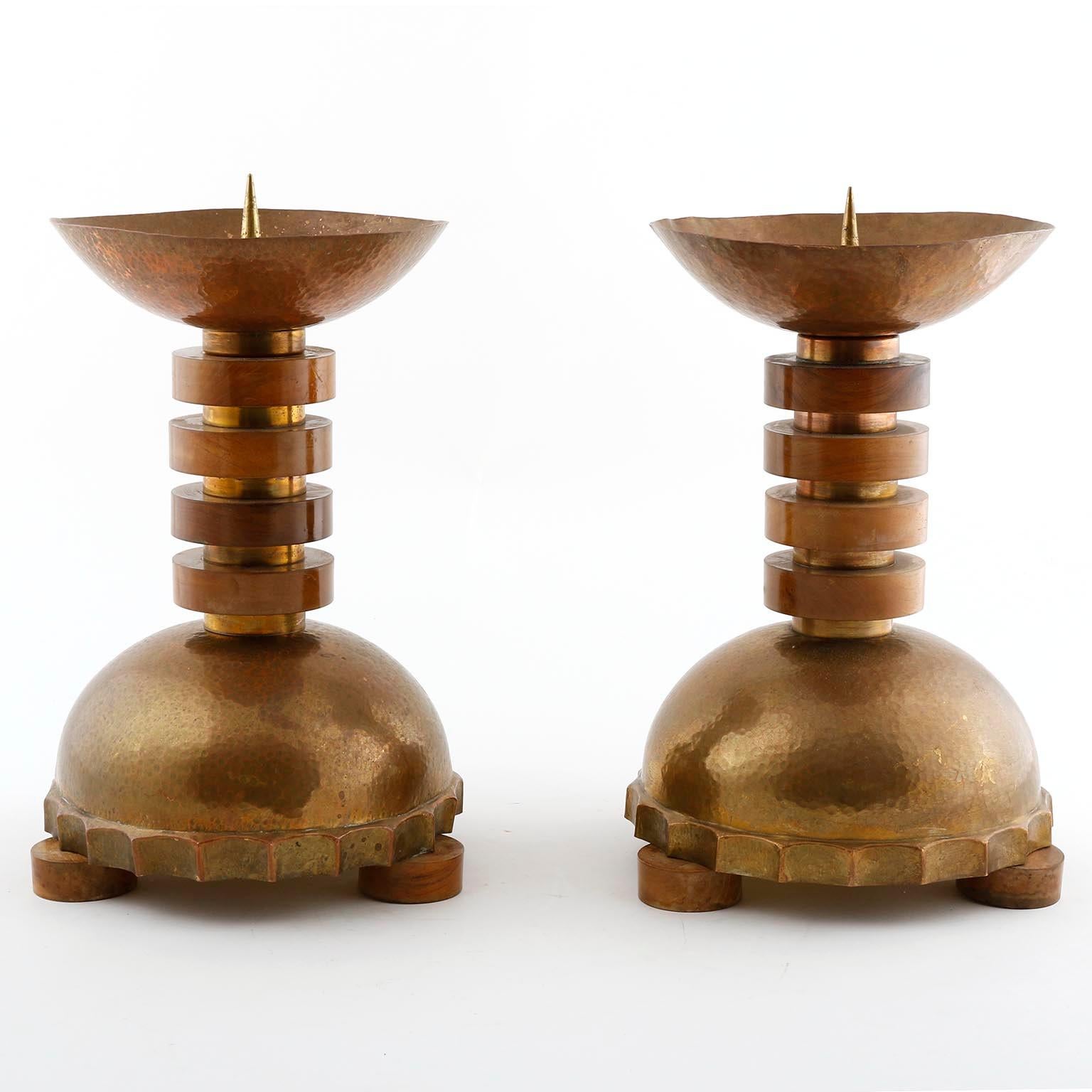 A pair of large and gorgeous candlesticks manufactured, circa 1930.
They are made of nut wood, hammered brass and copper with wonderful patina.