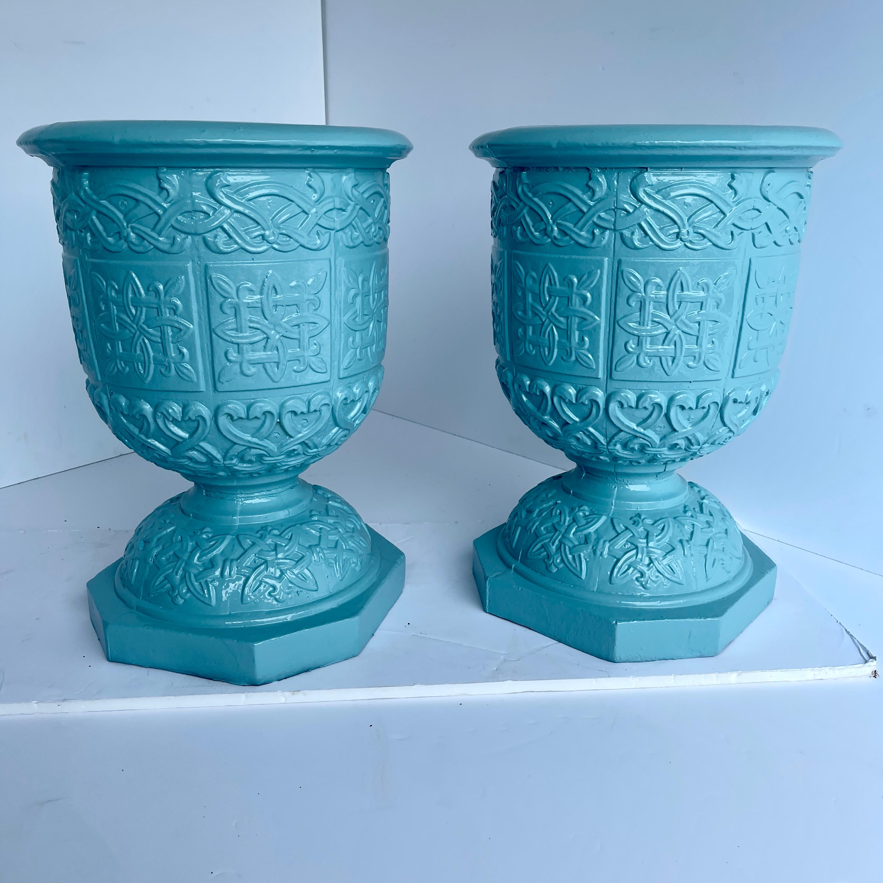 Large pair of turquoise powder-coated cast iron garden urns.