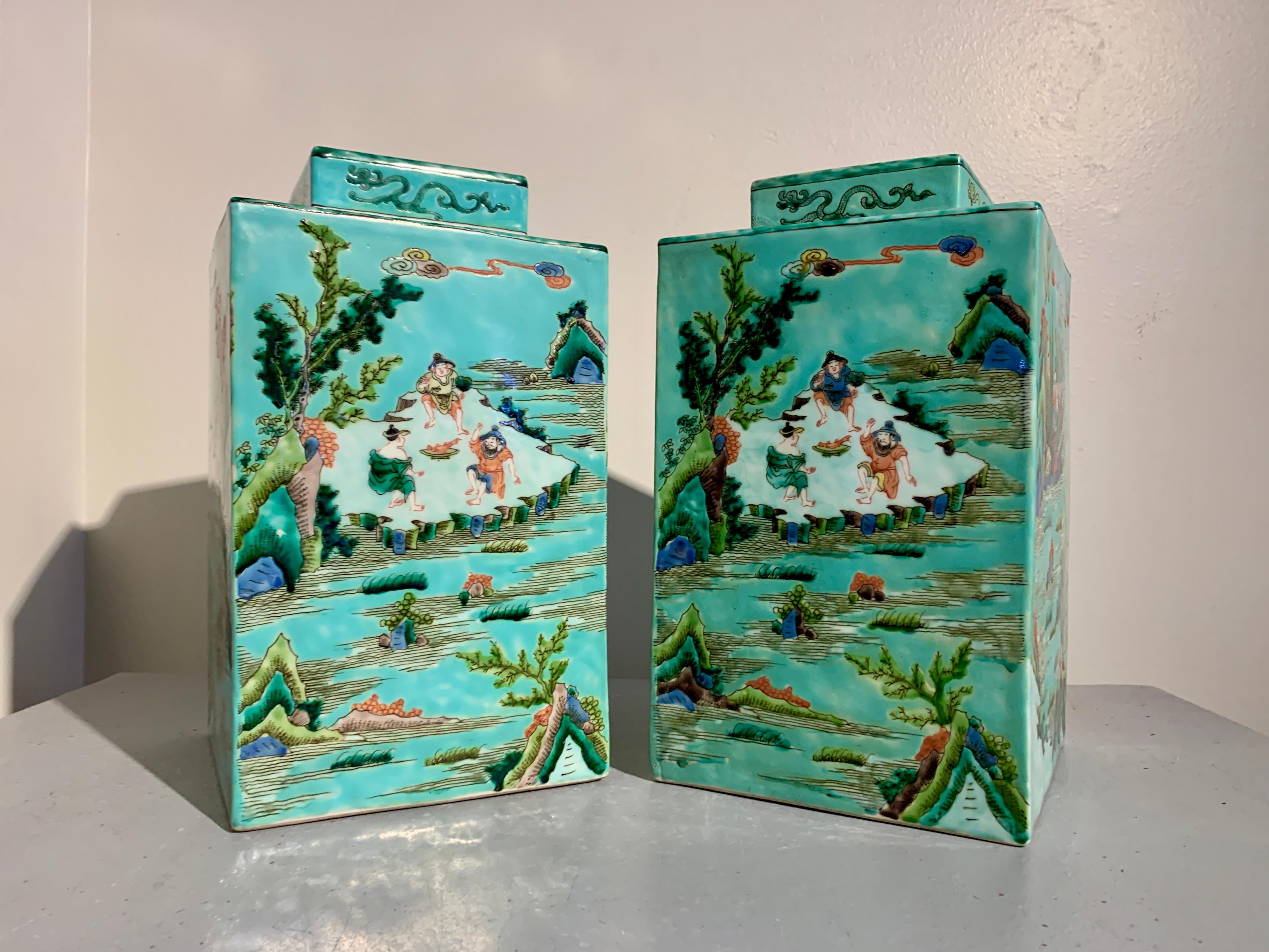 An attractive and highly decorative pair of large Chinese famille verte style enameled porcelain tea caddies and covers, with apocryphal Kangxi reign marks, early to mid 20th century, China.

The large porcelain tea caddies decorated on all sides