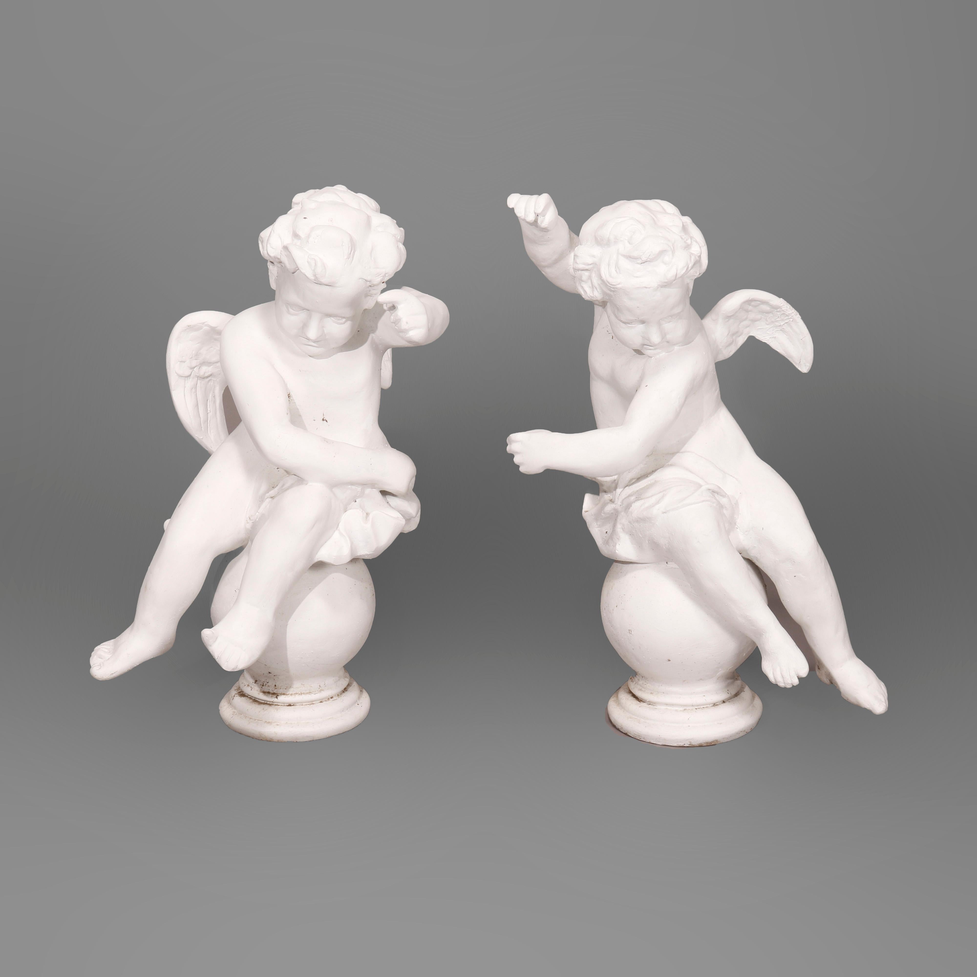 A pair of large Classical garden statues offer winged putti form in composition resin, 20th century

Measures - 31'' H x 22'' W x 18.5'' D.

Catalogue Note: Ask about DISCOUNTED DELIVERY RATES available to most regions within 1,500 miles of New York.