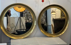 Pair Large concave brass frame circular mirrors